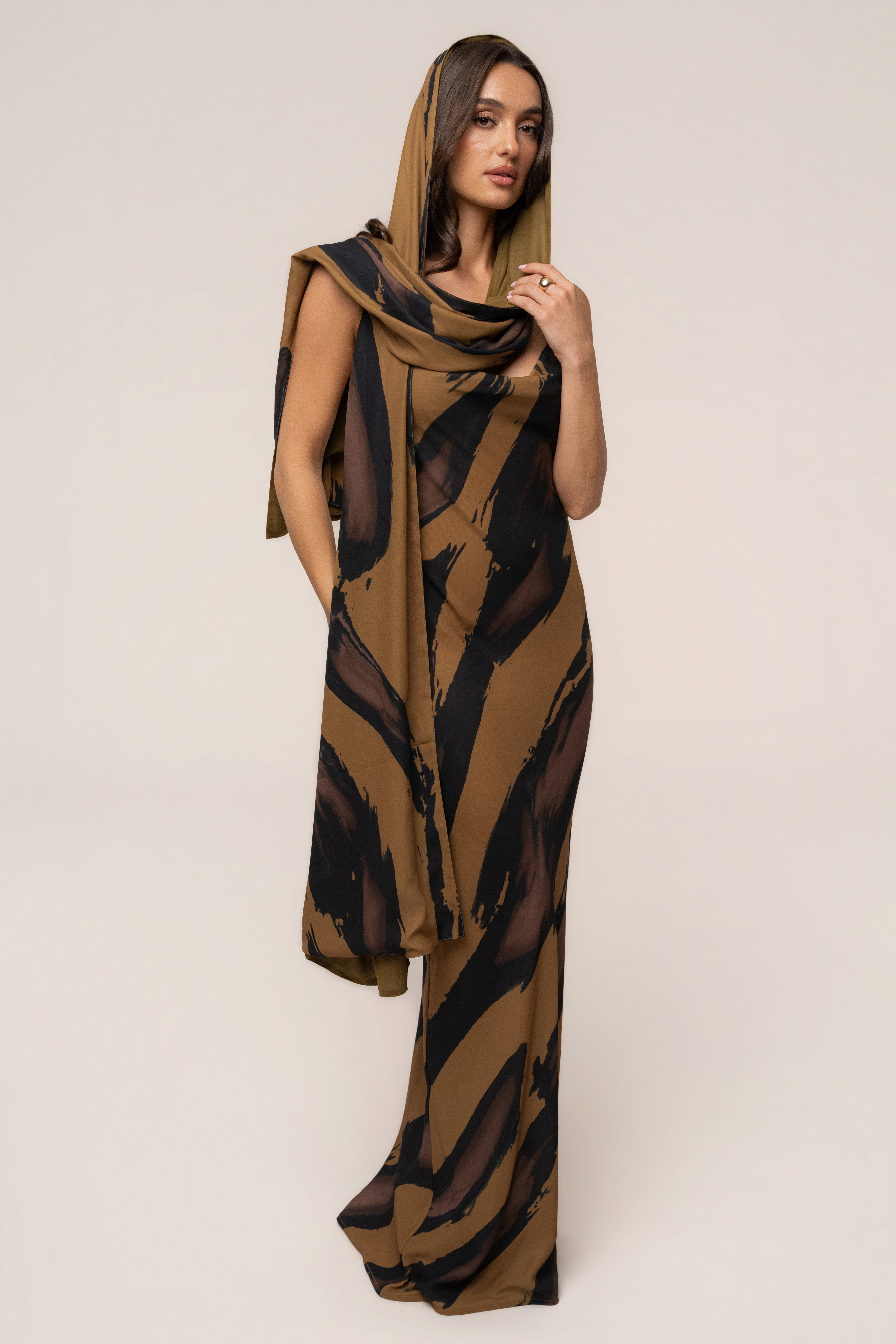 Gold Dusk Infinite Journey maxi dress by JLUXLABEL featuring flowing fabric and elegant design, perfect for upscale occasions.