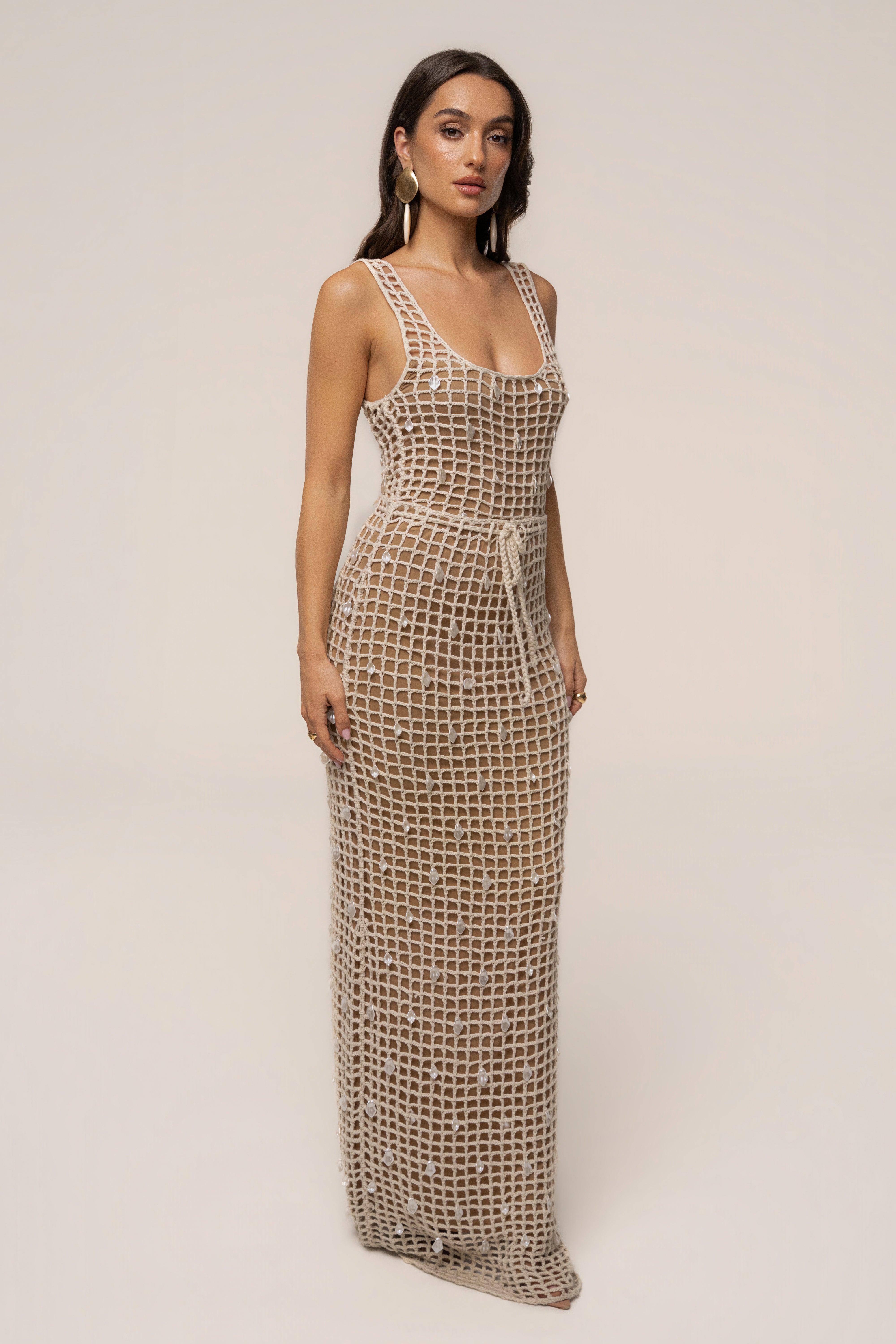 Ecru Pearl Shore crochet skirt by JLUXLABEL, showcasing intricate crochet design and pearl details, styled as a fashionable bottoms piece.