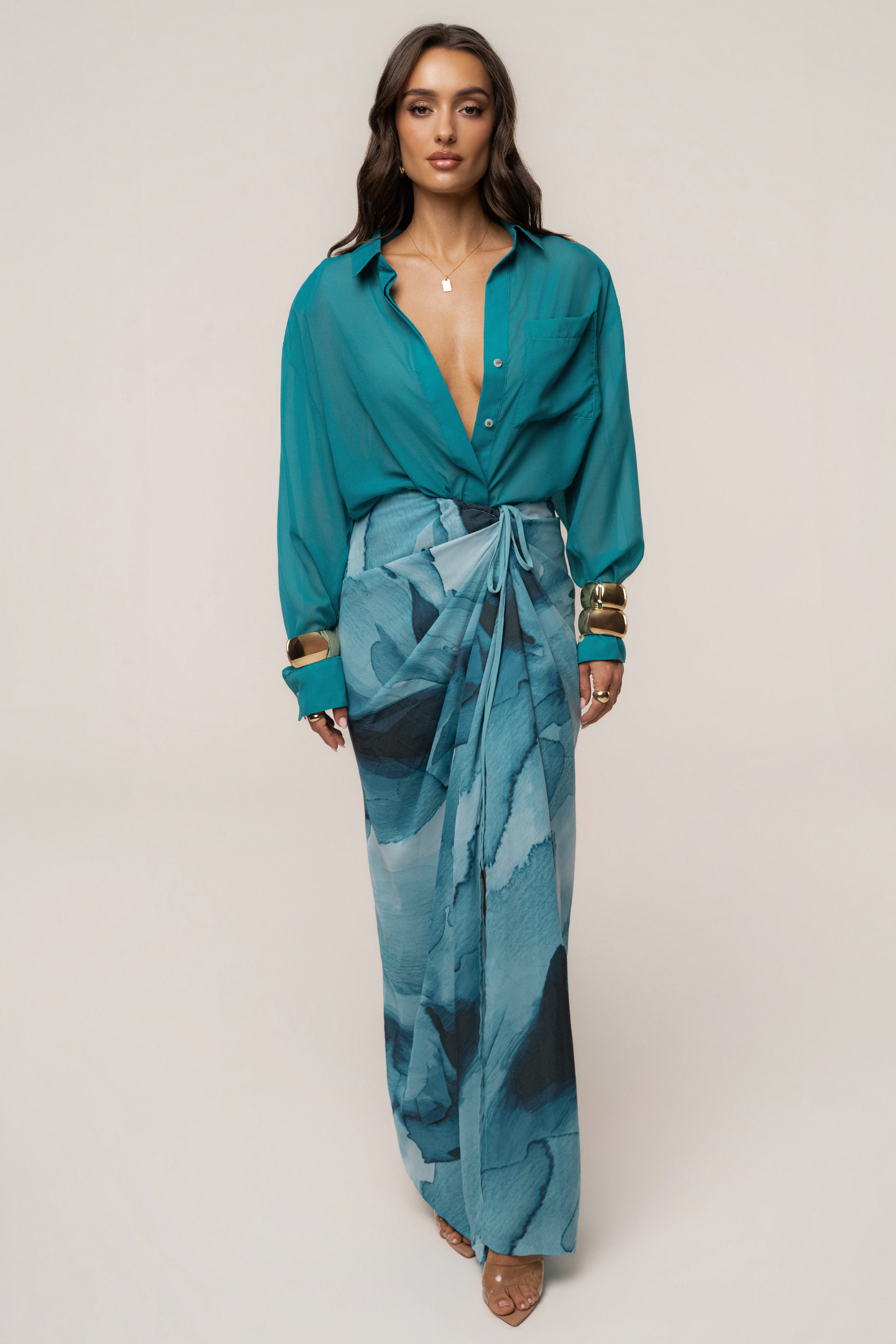 Blue abstract Noelia printed skirt from JLUXLABEL, stylish bottoms featuring a vibrant, artistic design.