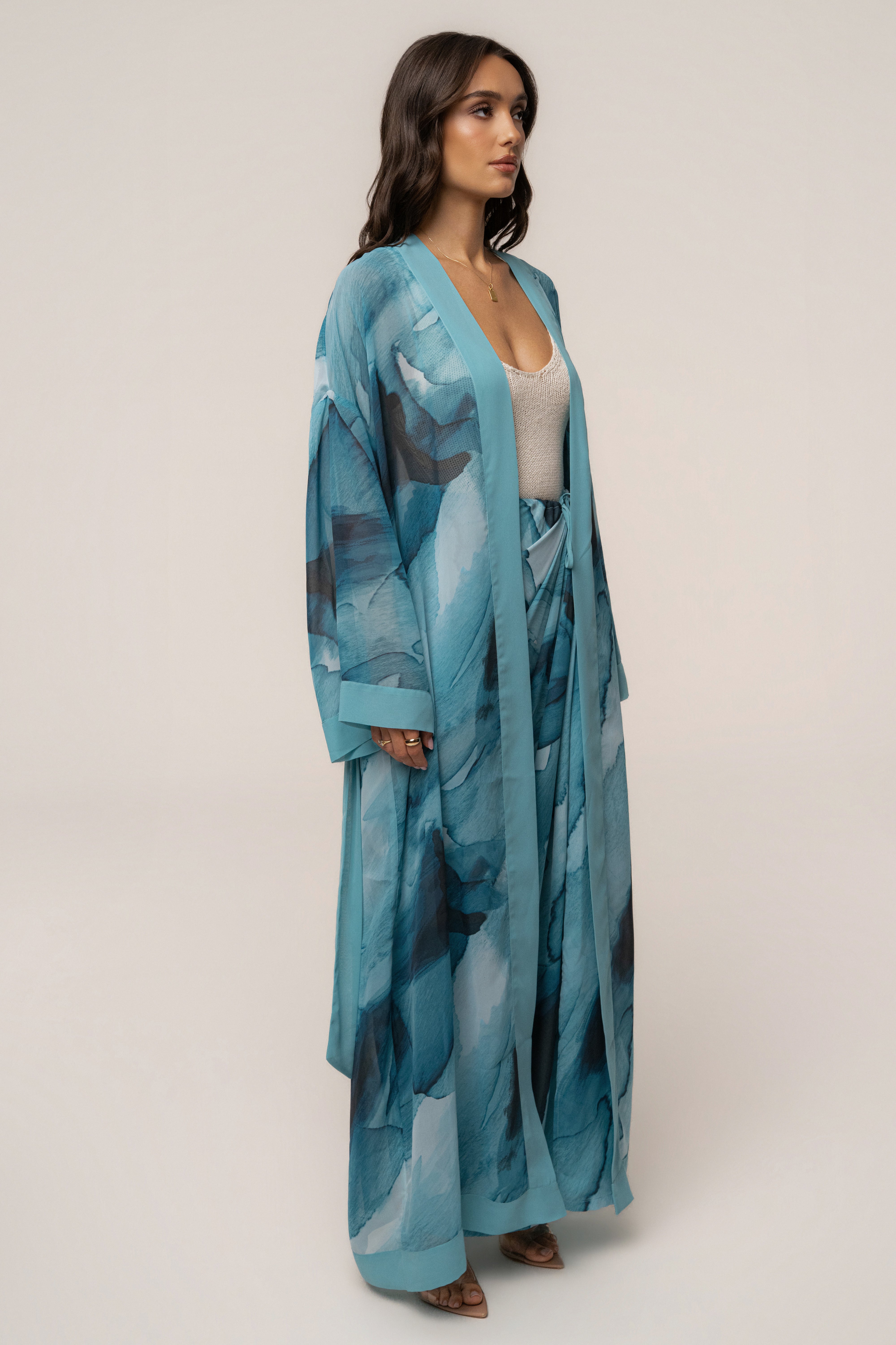 Blue abstract printed duster outerwear by JLUXLABEL featuring a flowing design and vibrant, artistic patterns.