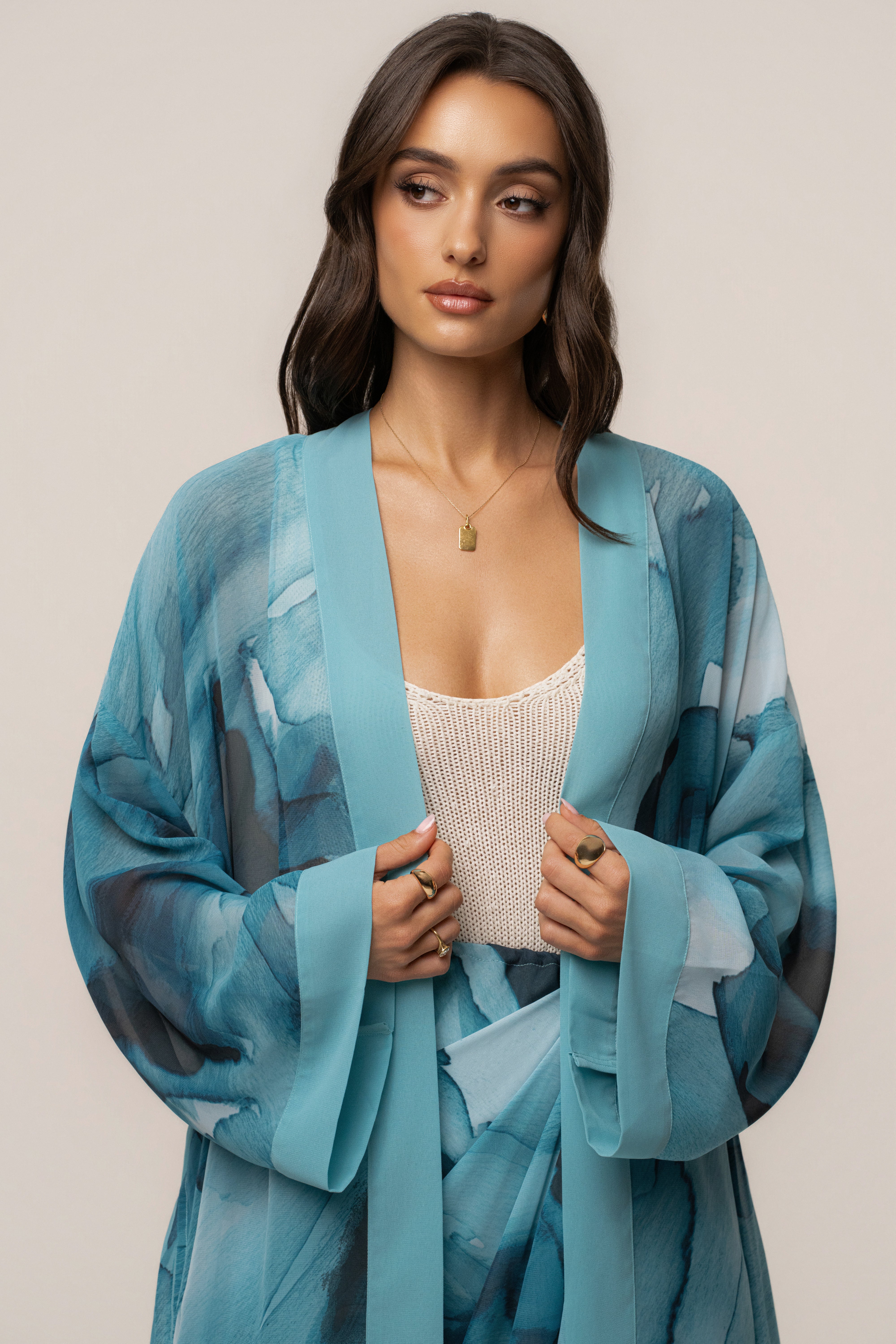 Blue abstract printed duster from JLUXLABEL, stylish outerwear with a flowing, lightweight design and vibrant pattern.