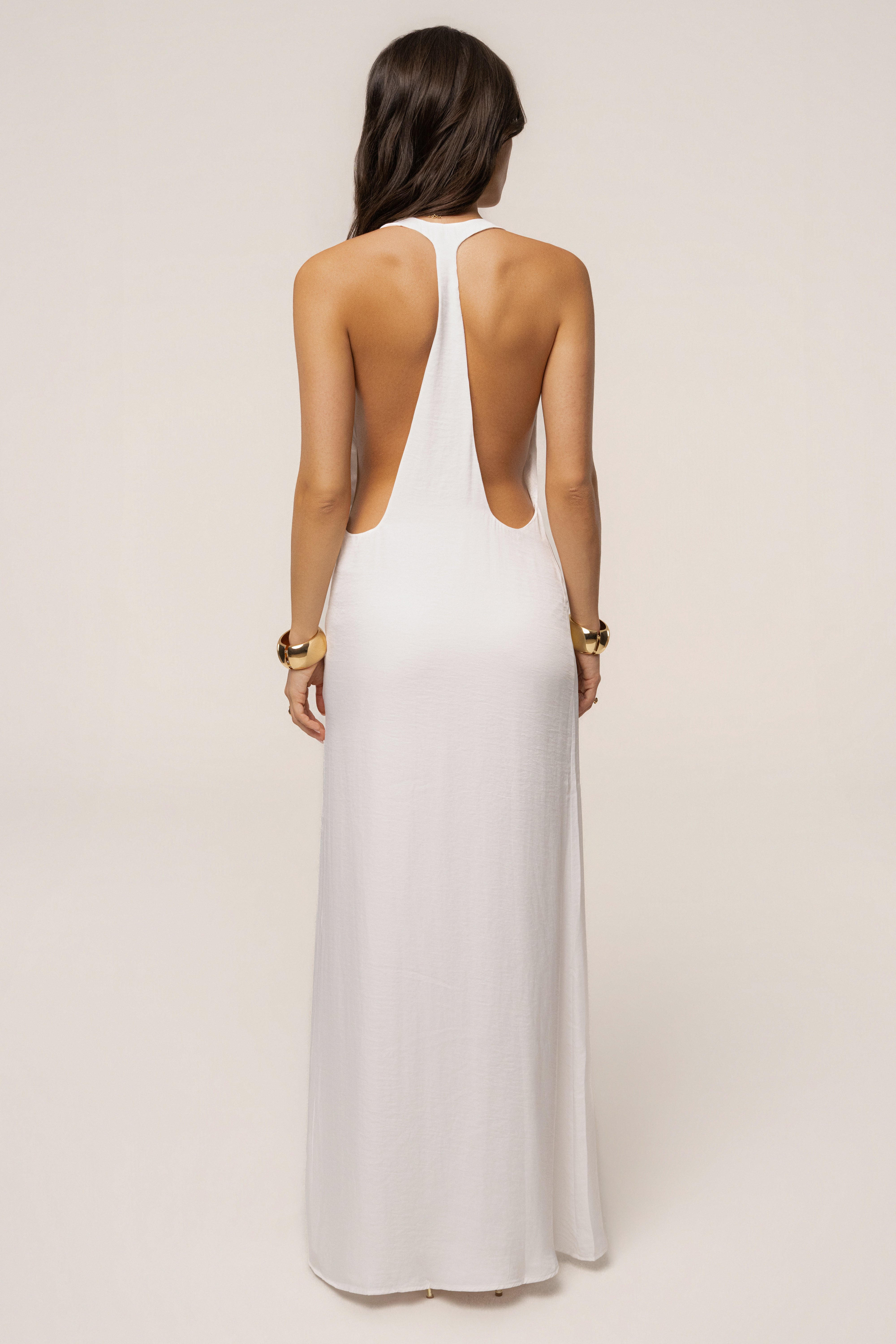 White Last Dance maxi dress by JLUXLABEL, flowing sleeveless dress with a fitted waist and elegant floor-length design.