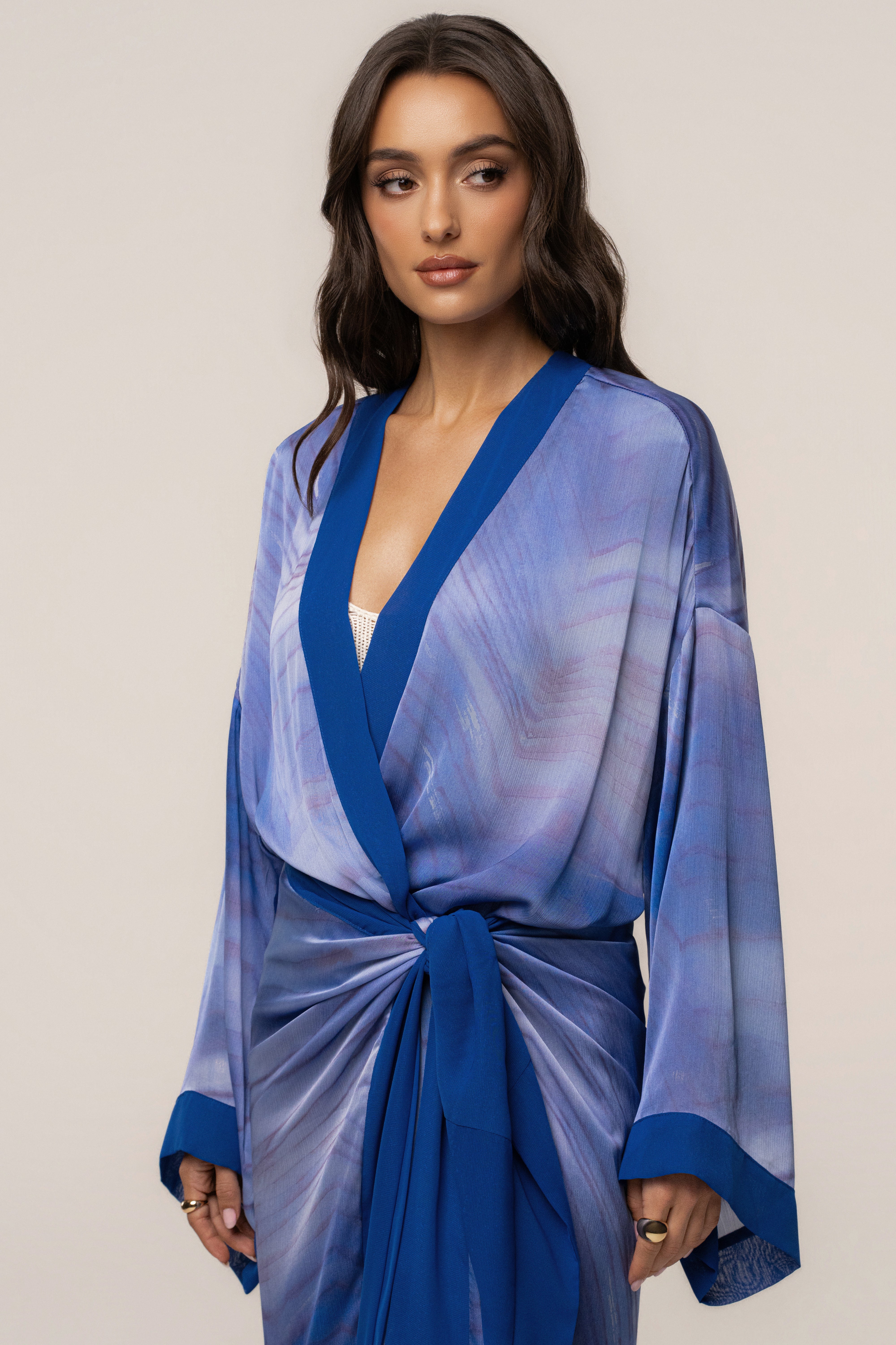 Blue Bahía satin duster outerwear by JLUXLABEL, flowing fabric with long sleeves and a relaxed fit, styled for elegant layering.