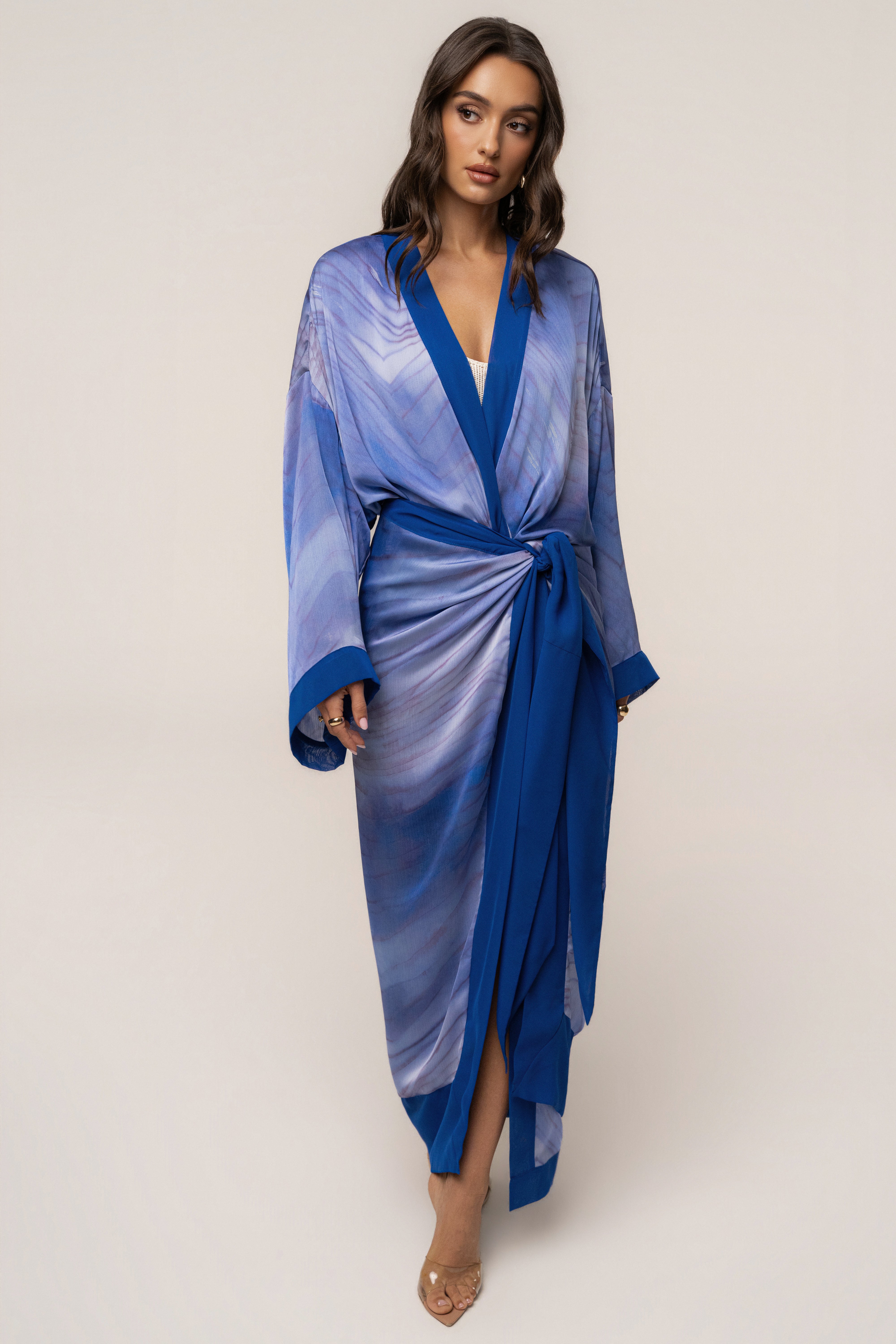 Blue Bahía satin duster from JLUXLABEL, stylish outerwear with a smooth satin finish and flowing silhouette.