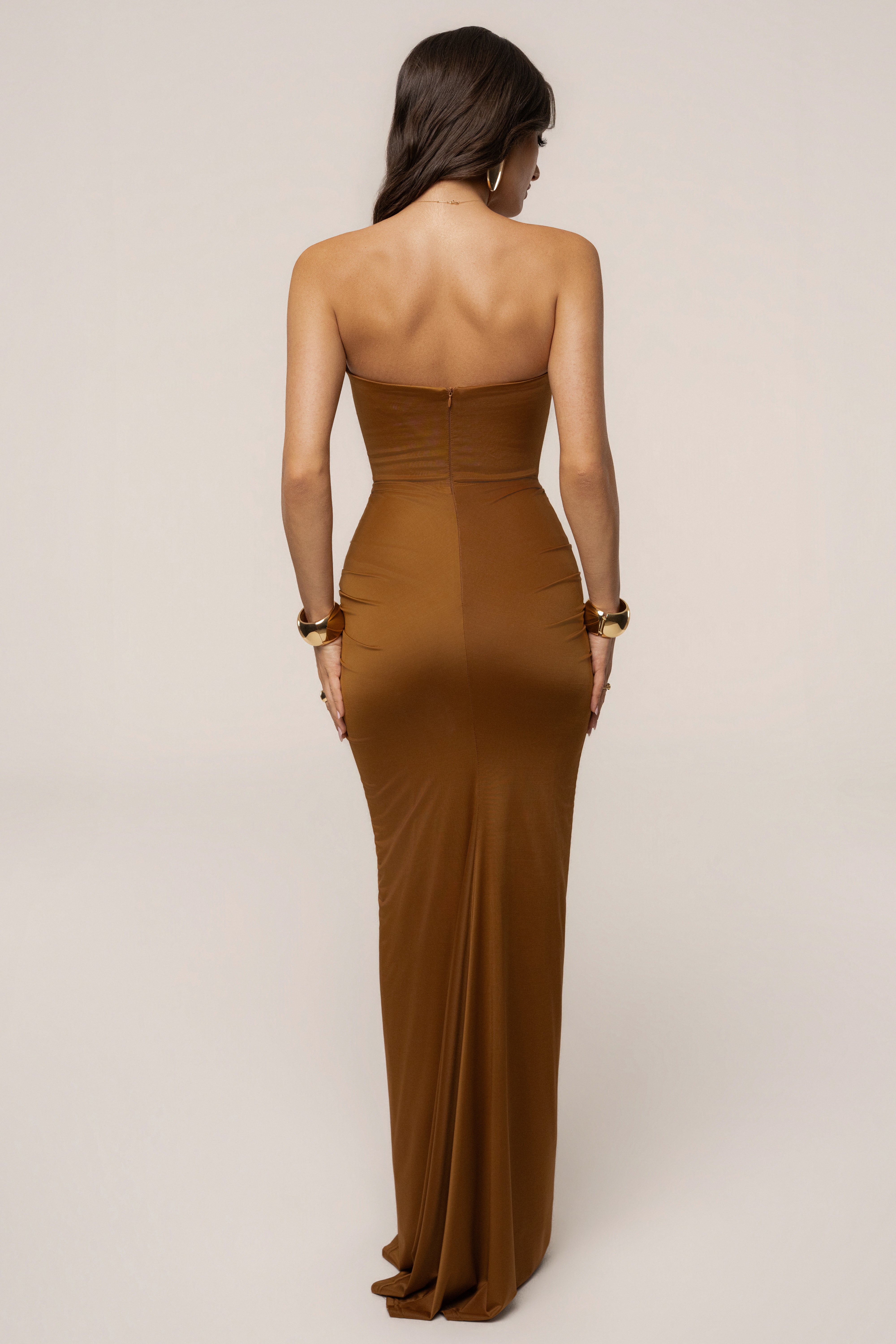 Tan Isabella strapless maxi gown by JLUXLABEL featuring flowing fabric and elegant design, perfect for formal occasions.