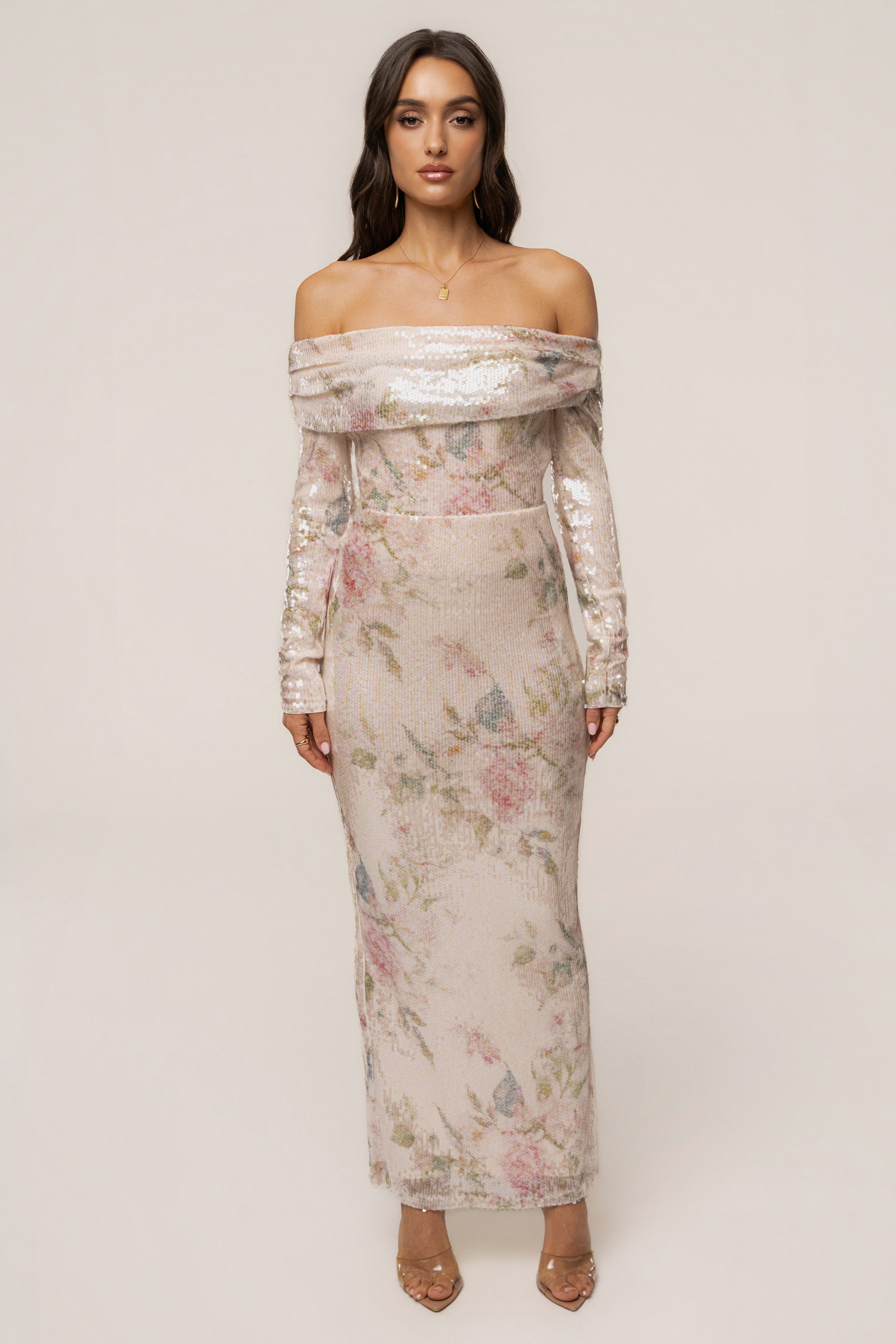 Ivory floral Villa Nights sequin bodysuit by JLUXLABEL, featuring floral embroidery and shimmering sequin details, displayed on a mannequin.