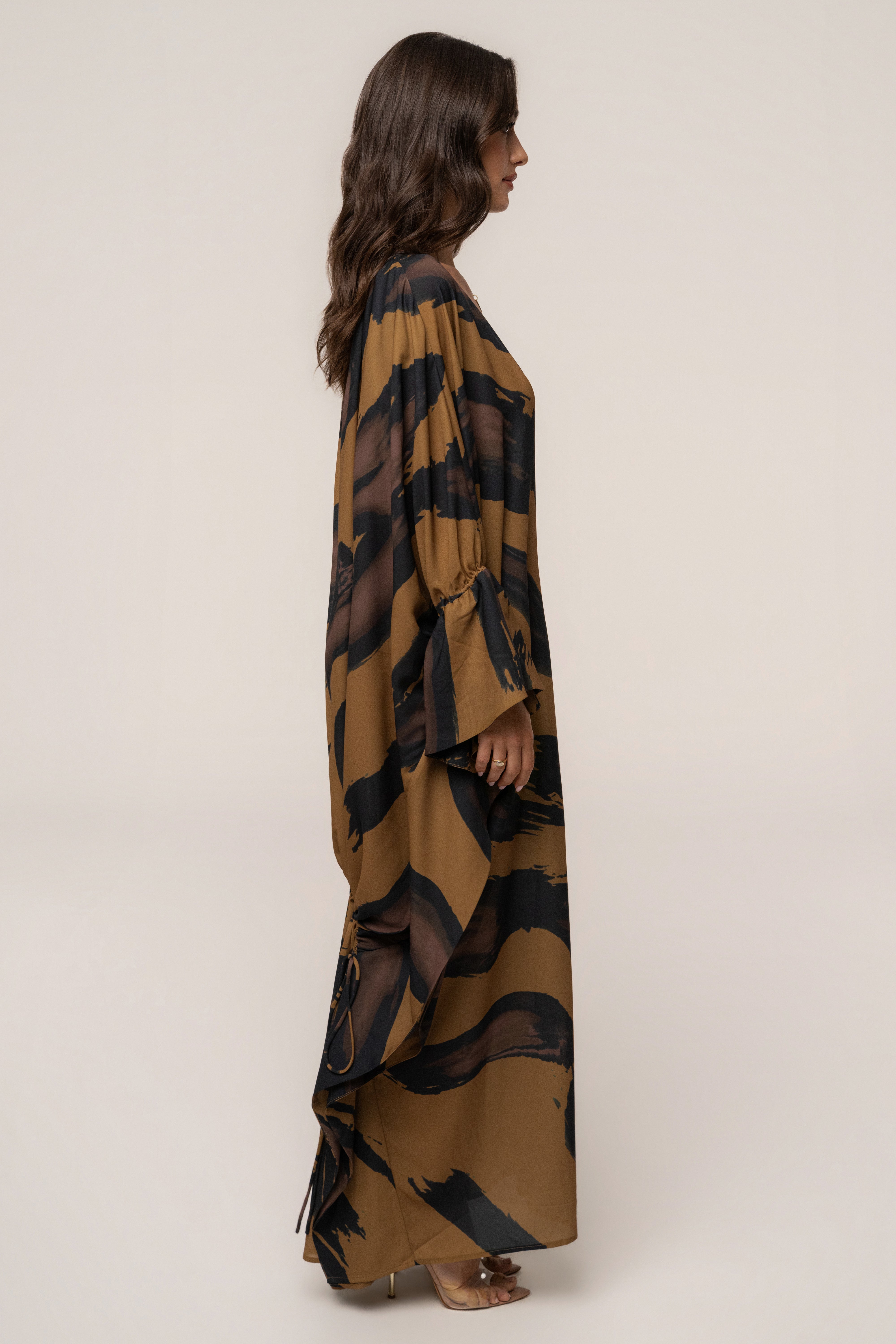 Gold Dusk Sienna sheer cover-up dress by JLUXLABEL, lightweight and flowy with elegant sheer fabric and gold-toned accents.