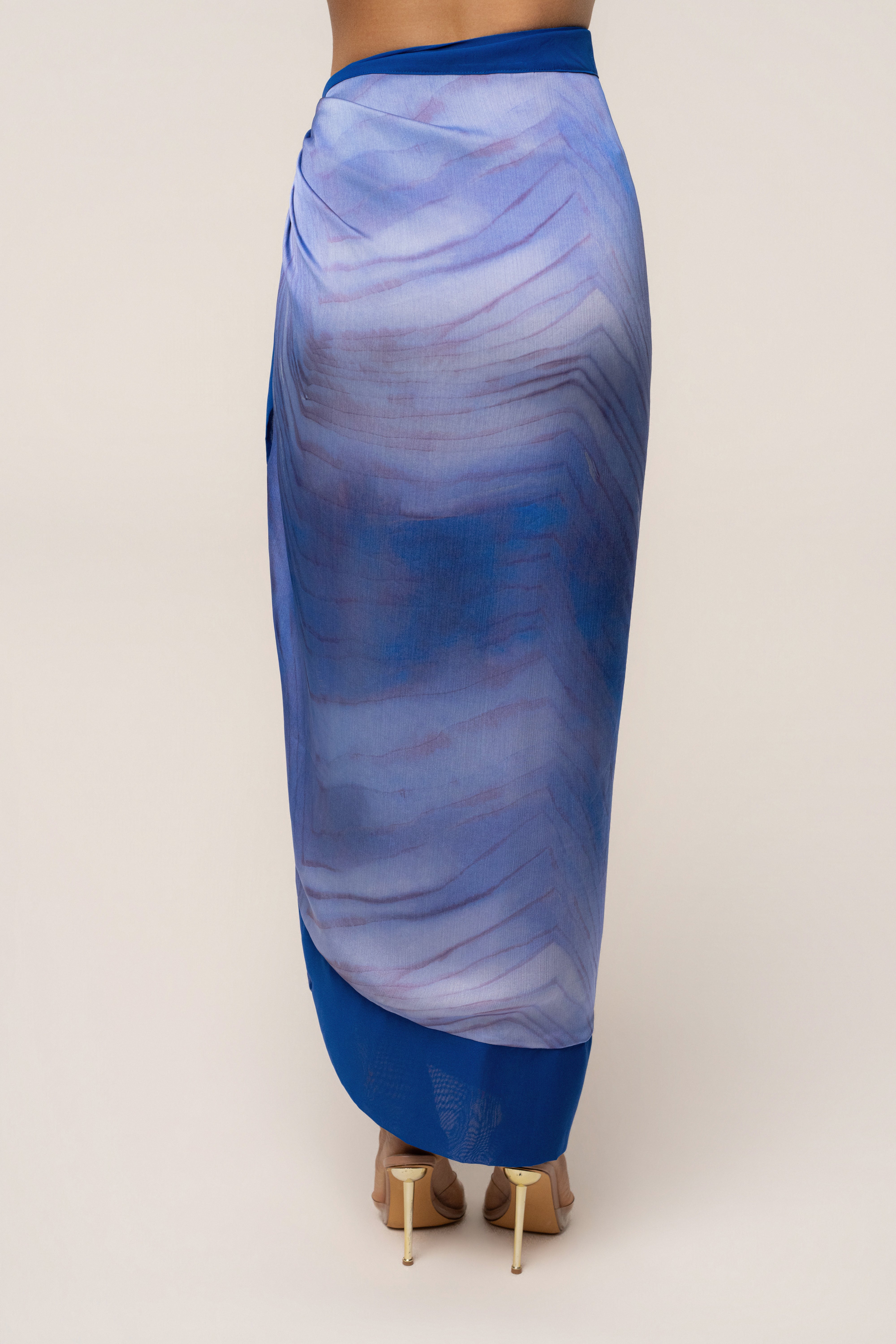 Blue Bahía wrap skirt by JLUXLABEL, stylish bottoms with a flowy design, shown in this image.