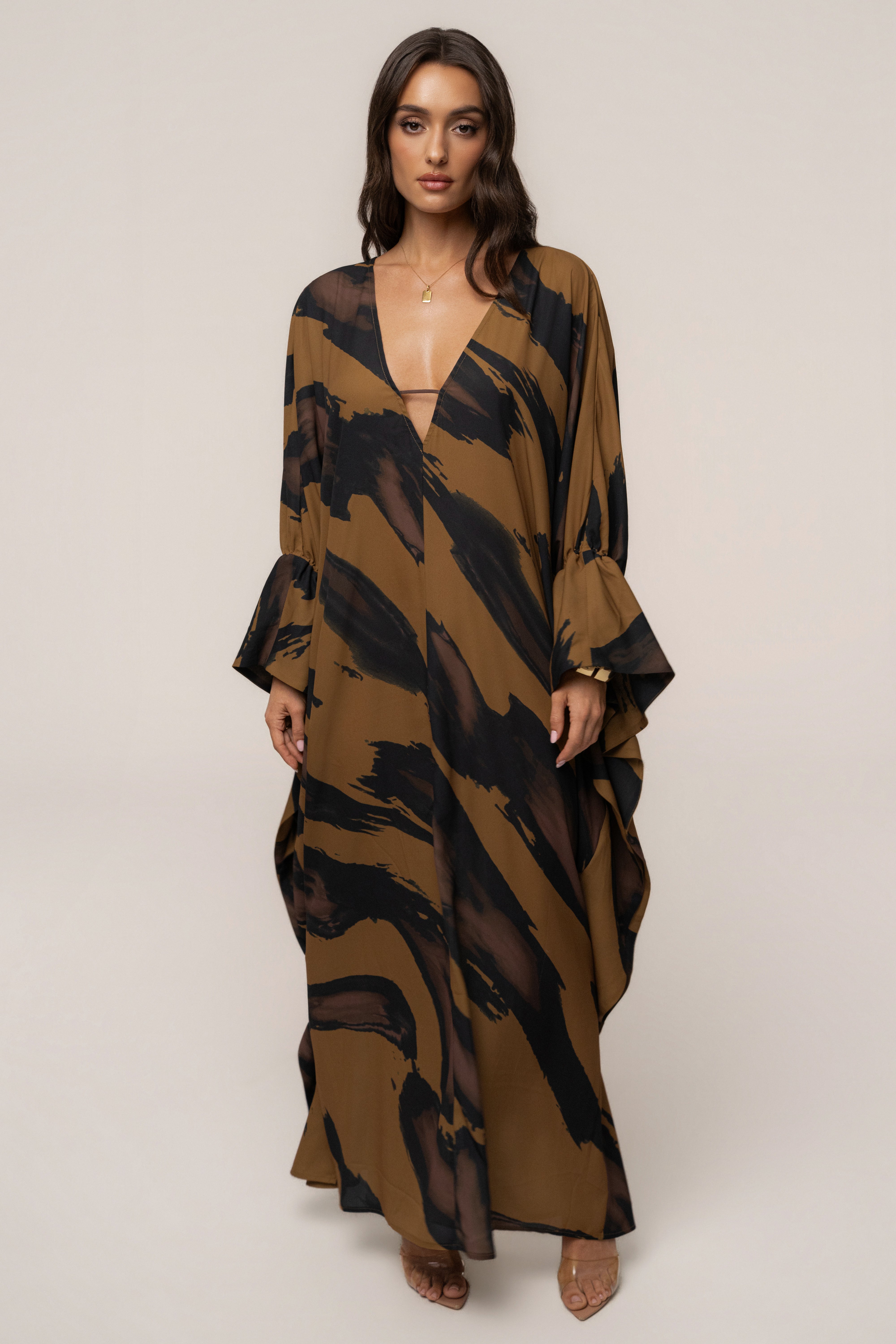 Gold Dusk Sienna sheer cover-up dress by JLUXLABEL, featuring lightweight fabric and elegant design for stylish wear.