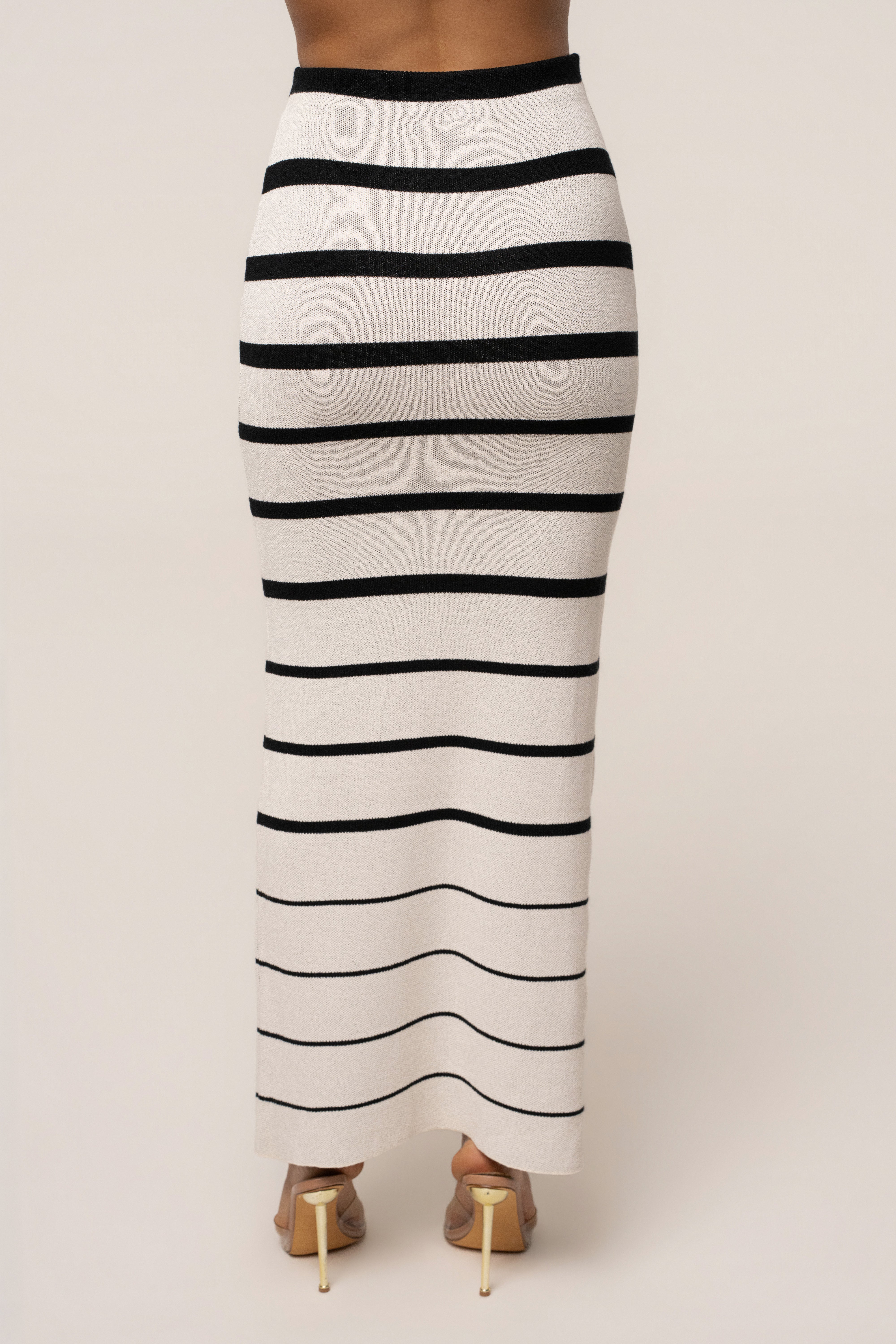 White and black striped Marina Nights skirt set by JLUXLABEL featuring a stylish, coordinated two-piece outfit with a fitted top and skirt.