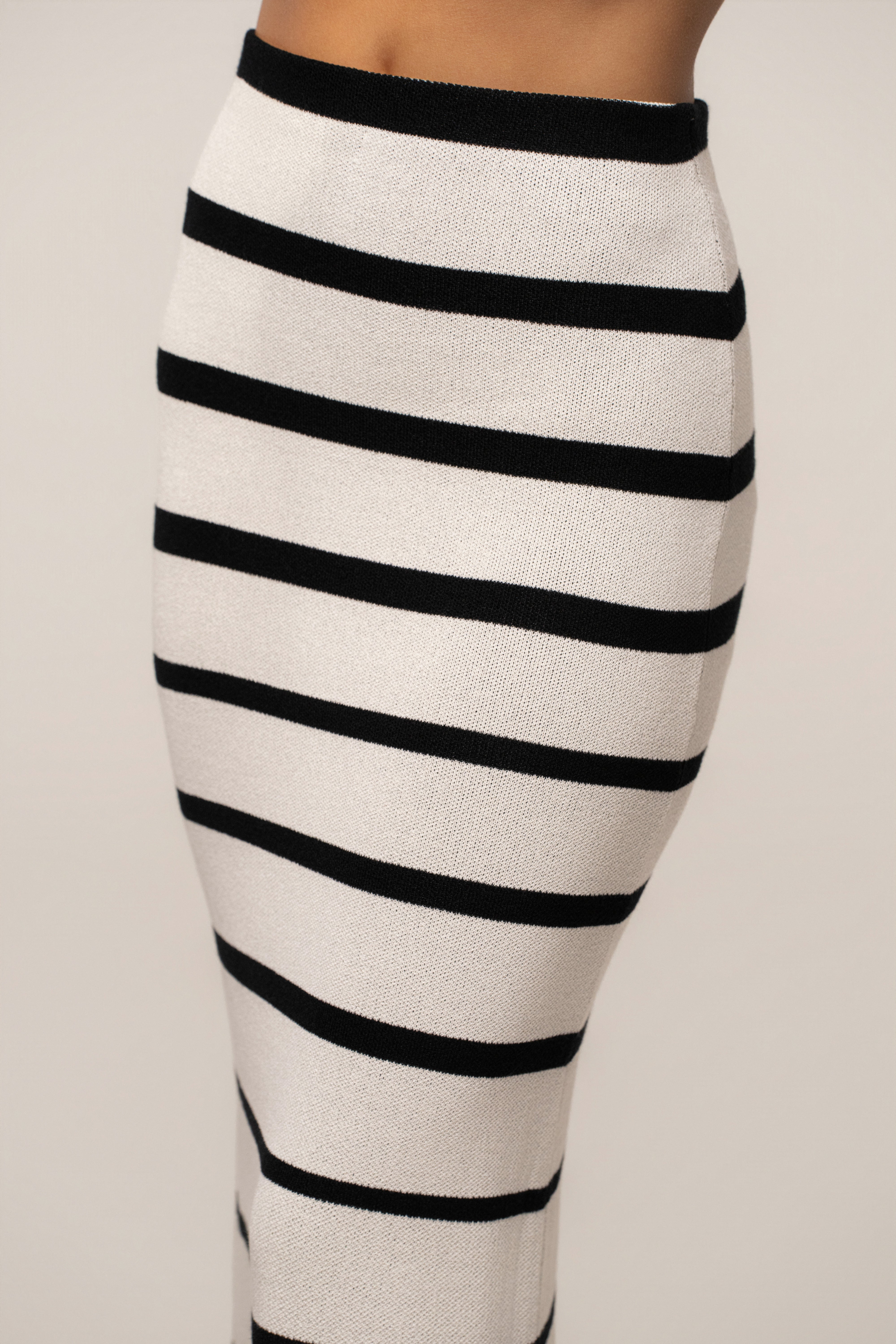 White and black striped Marina Nights skirt set by JLUXLABEL, featuring a stylish matching top and skirt ensemble.