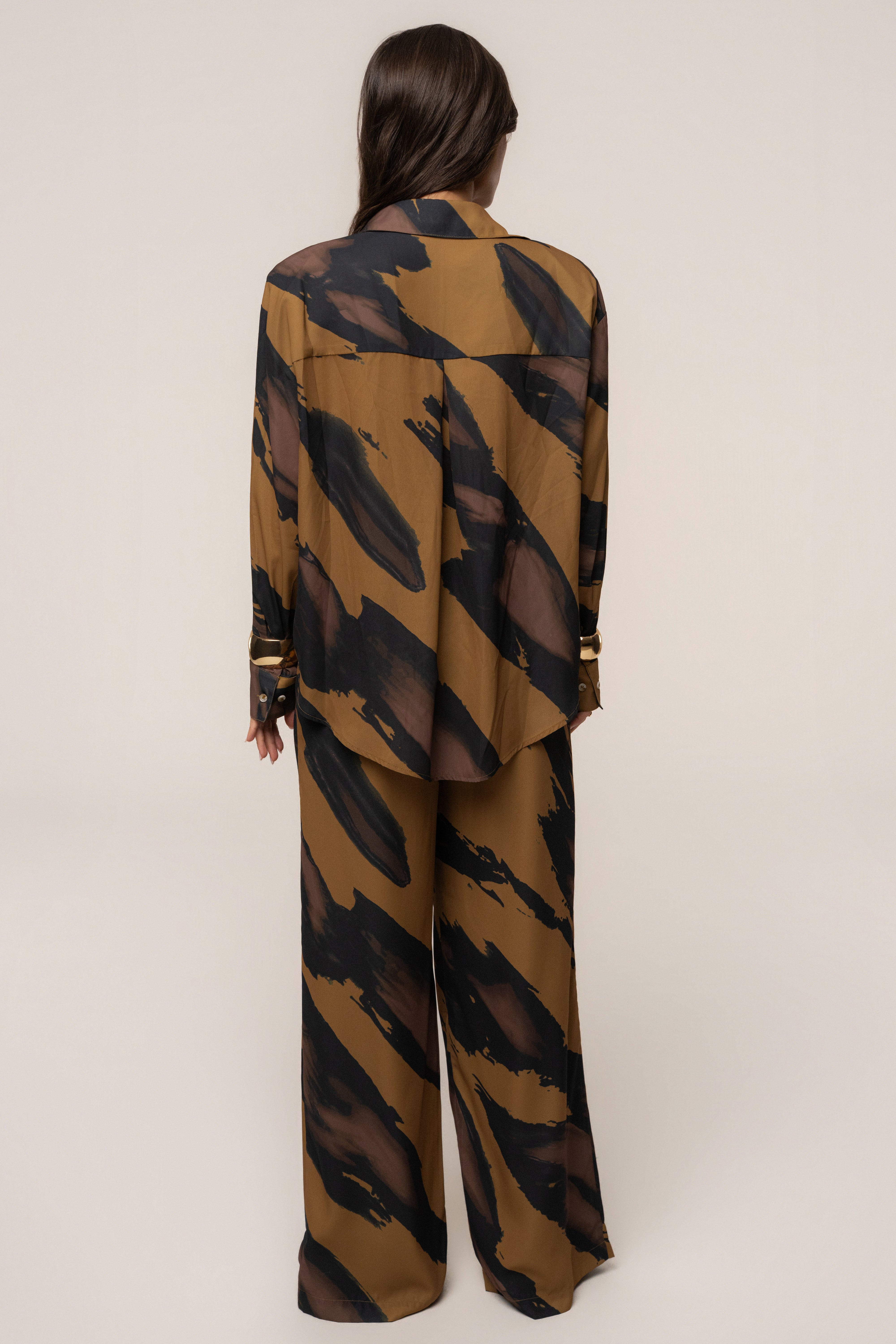 Gold Dusk Fierce Form button-down shirt by JLUXLABEL, featuring a stylish gold-toned top with a classic collar and long sleeves.