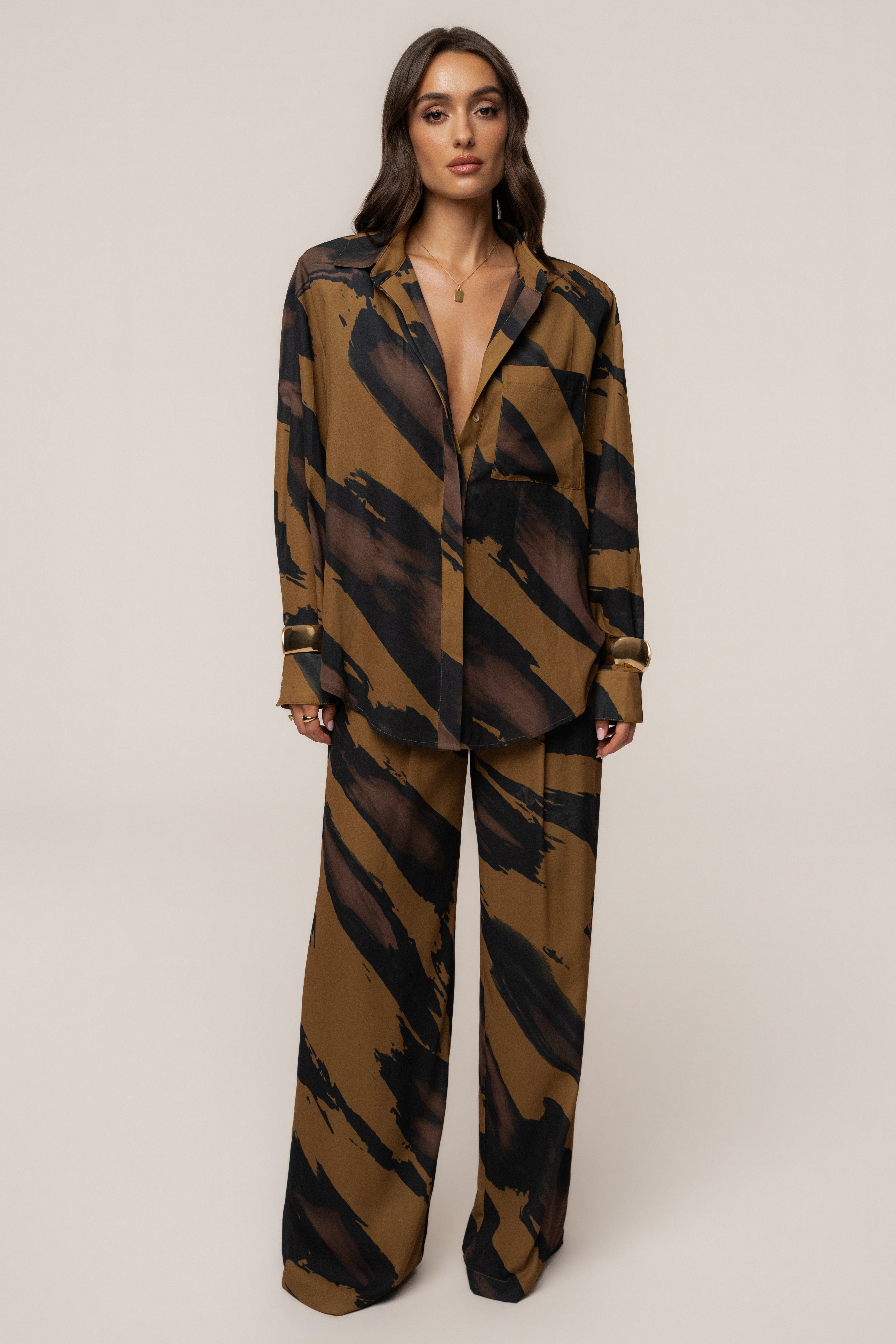 Gold Dusk soft pleated trousers from JLUXLABEL, shown as stylish bottoms with tailored pleats and a relaxed fit.