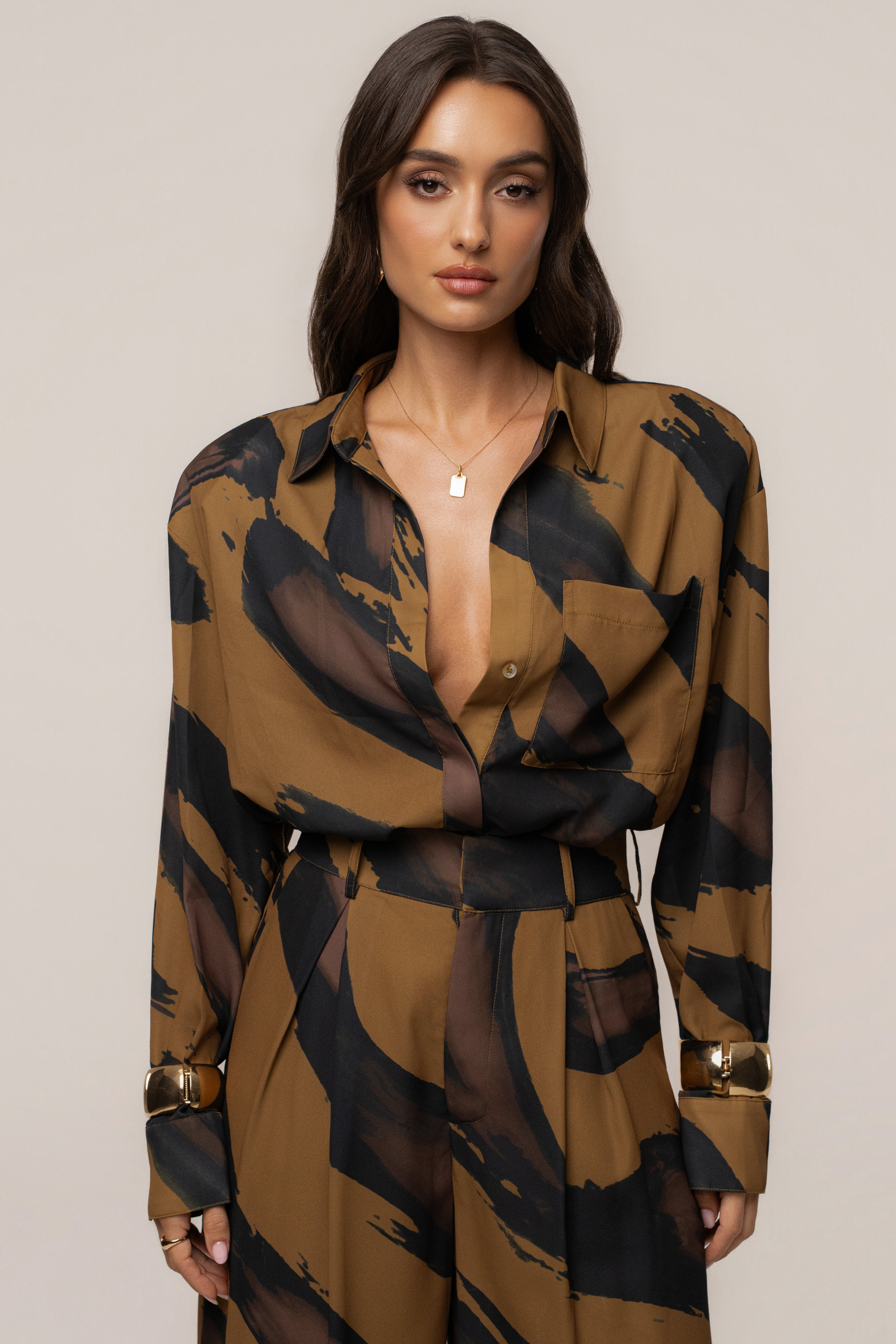 Gold Dusk Fierce Form button-down shirt by JLUXLABEL, featuring a stylish gold-toned top with a classic collar and long sleeves.