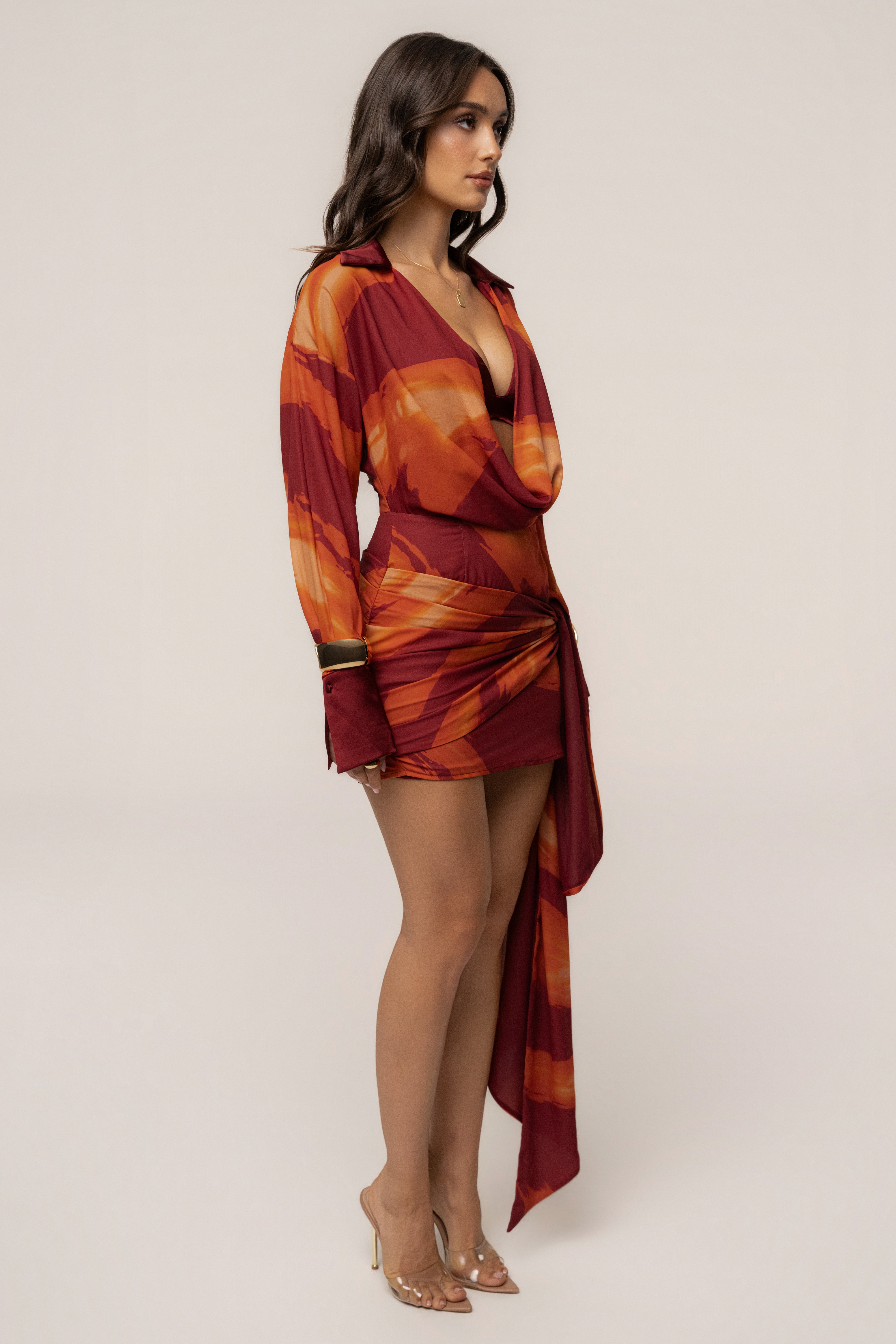 Crimson Dusk Midnight Confidence Mini Dress by JLUXLABEL, featuring a fitted silhouette and elegant neckline, displayed on a dress form.