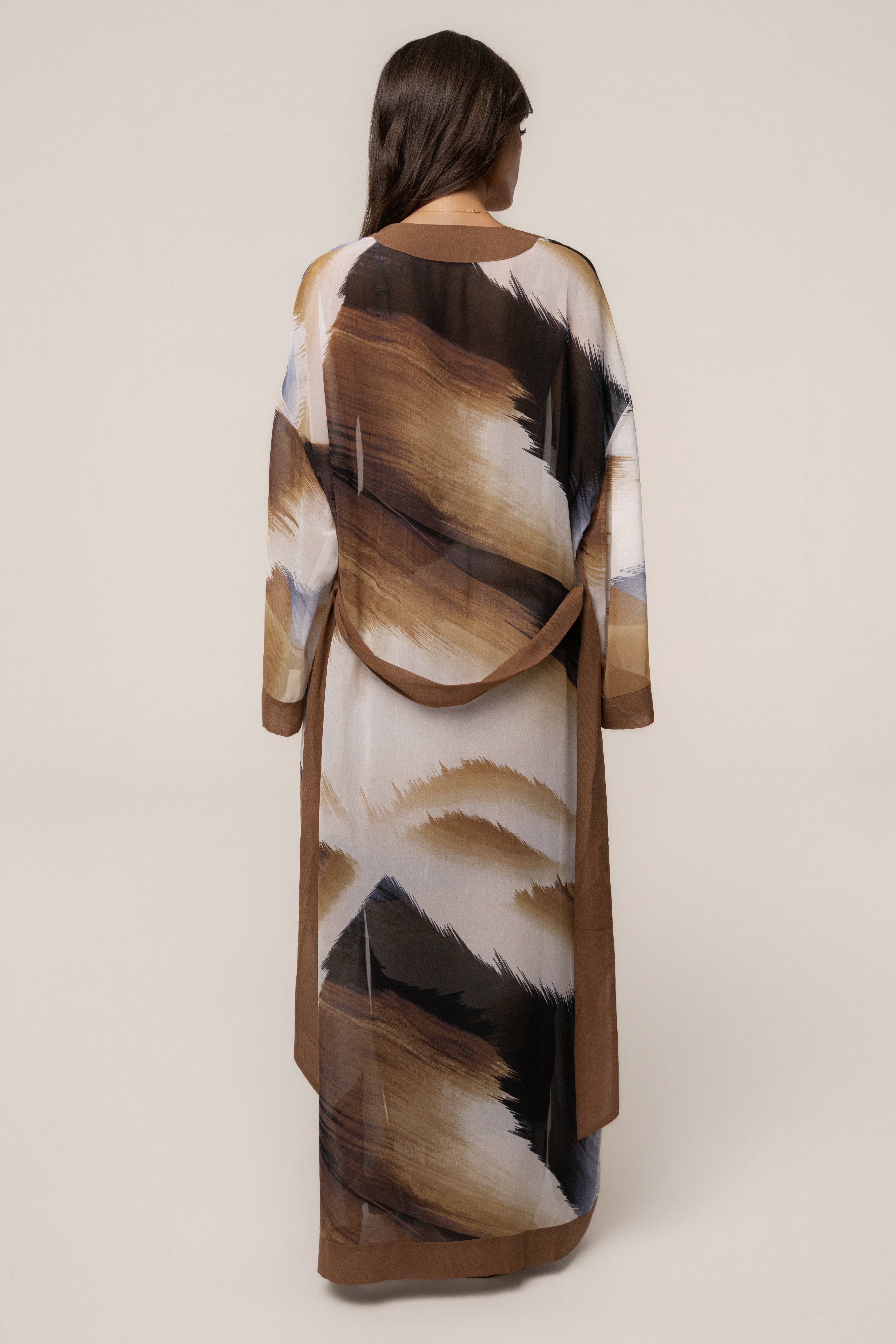 Brown abstract printed duster outerwear by JLUXLABEL with flowing fabric and modern design, perfect for layered stylish looks.