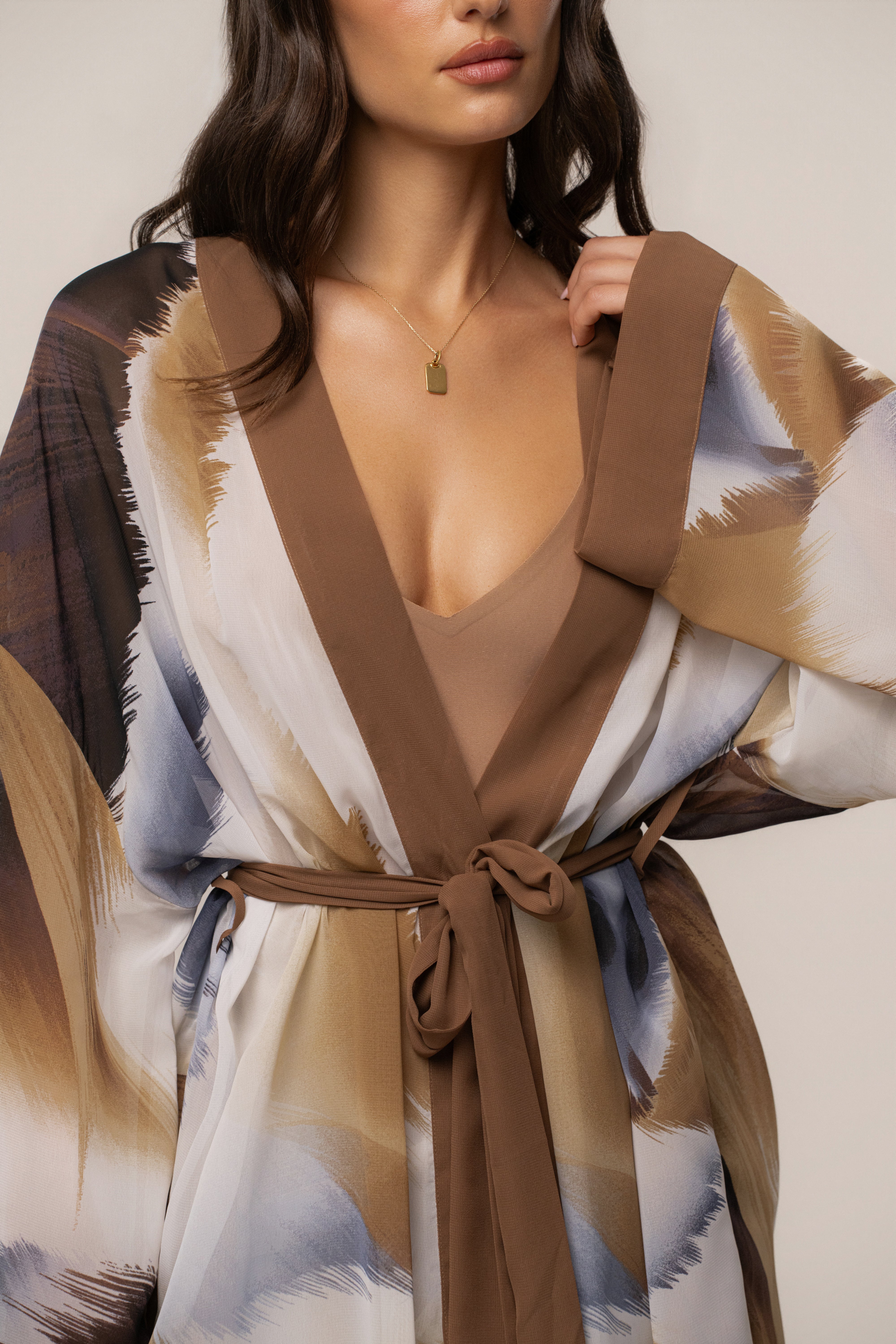 Brown abstract printed duster outerwear by JLUXLABEL featuring a stylish, flowy design with a modern, artistic pattern.