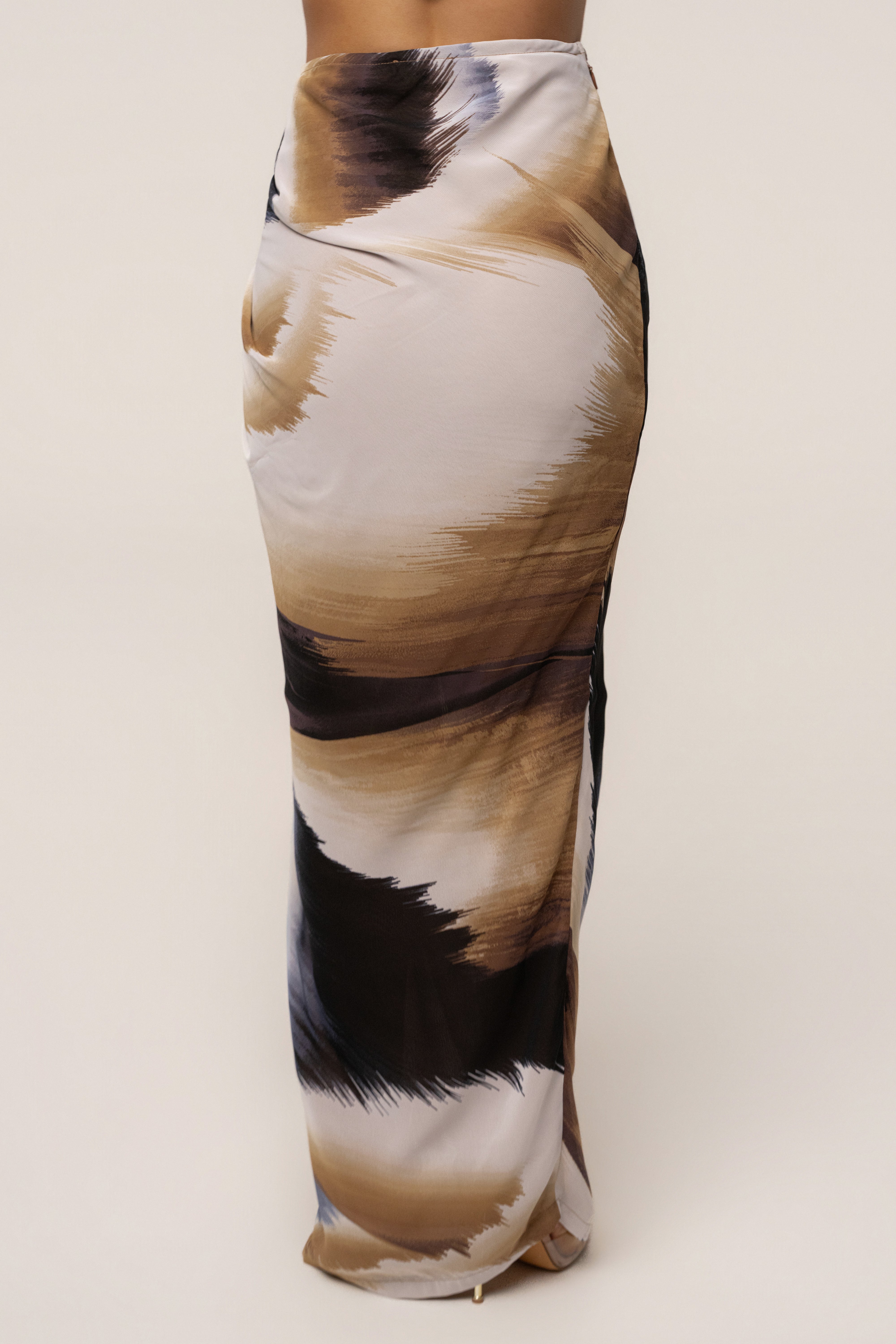 Brown abstract printed Noelia skirt by JLUXLABEL, showcasing a stylish printed skirt with a flowy design for casual or dressy wear.