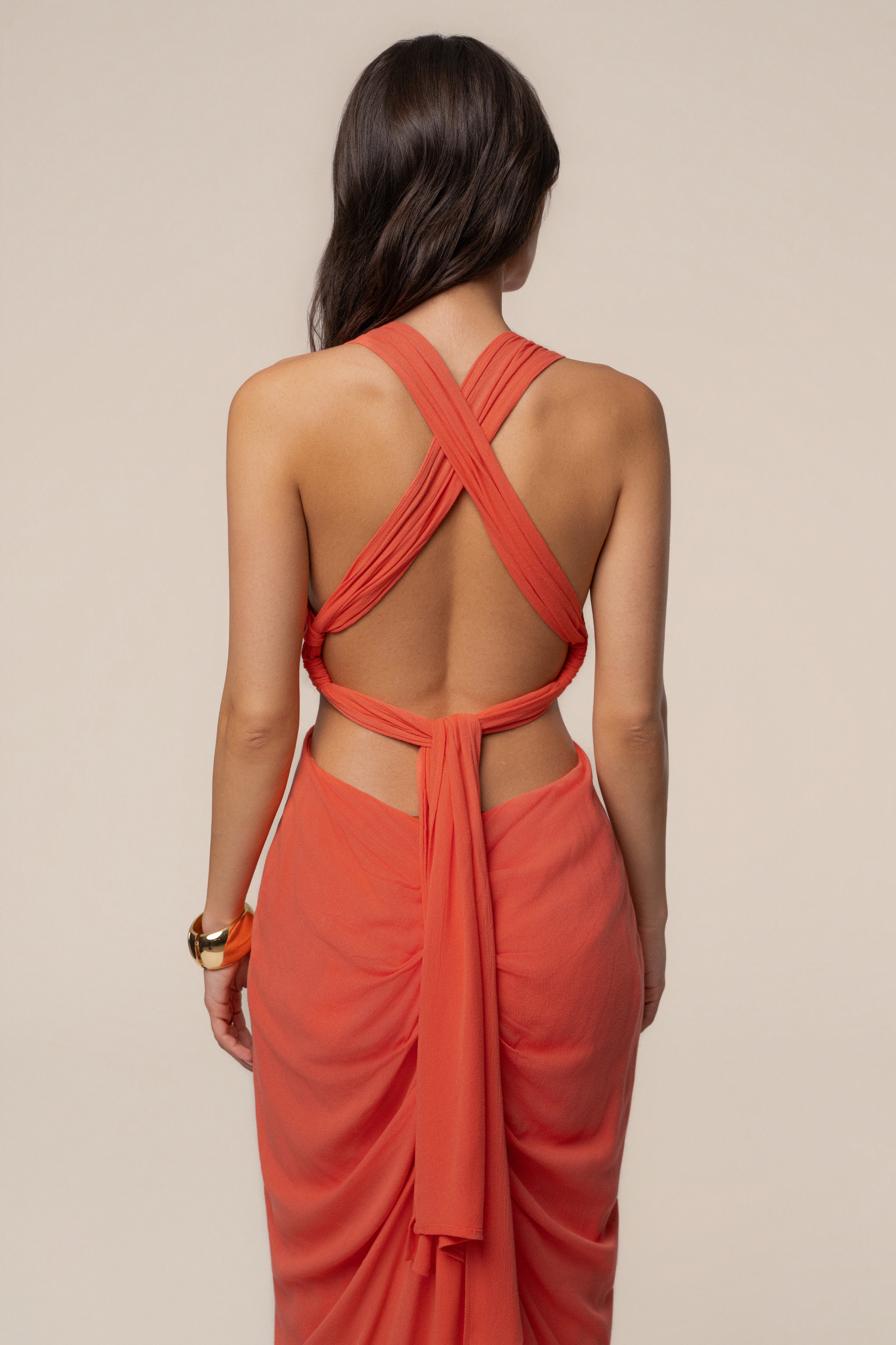 Coral warm sunset maxi dress by JLUXLABEL featuring flowing fabric and vibrant sunset-inspired pattern.
