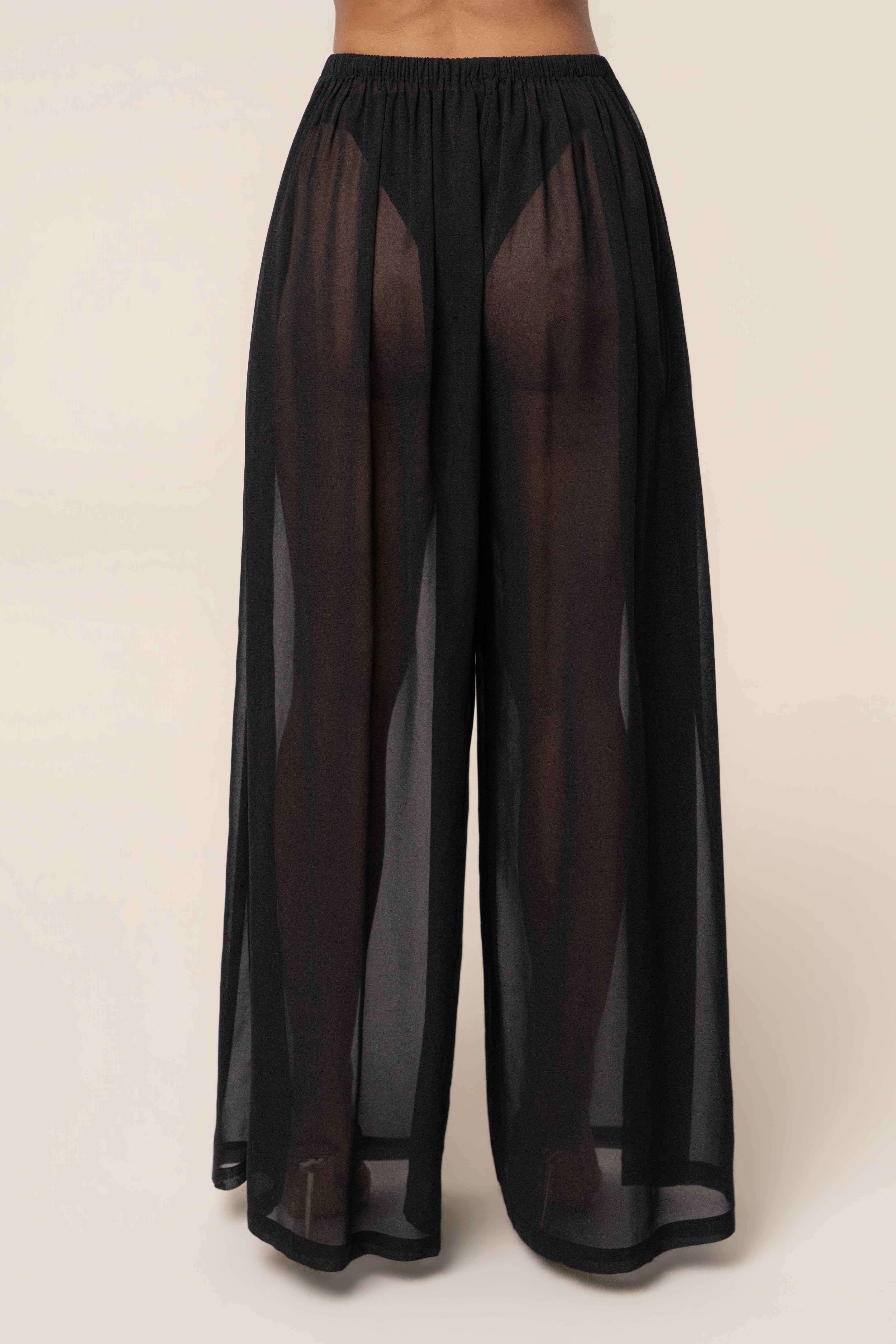 Black JLUXLABEL Resort Glow chiffon pants, stylish bottoms with flowy fabric and relaxed fit, perfect for resort or casual wear.