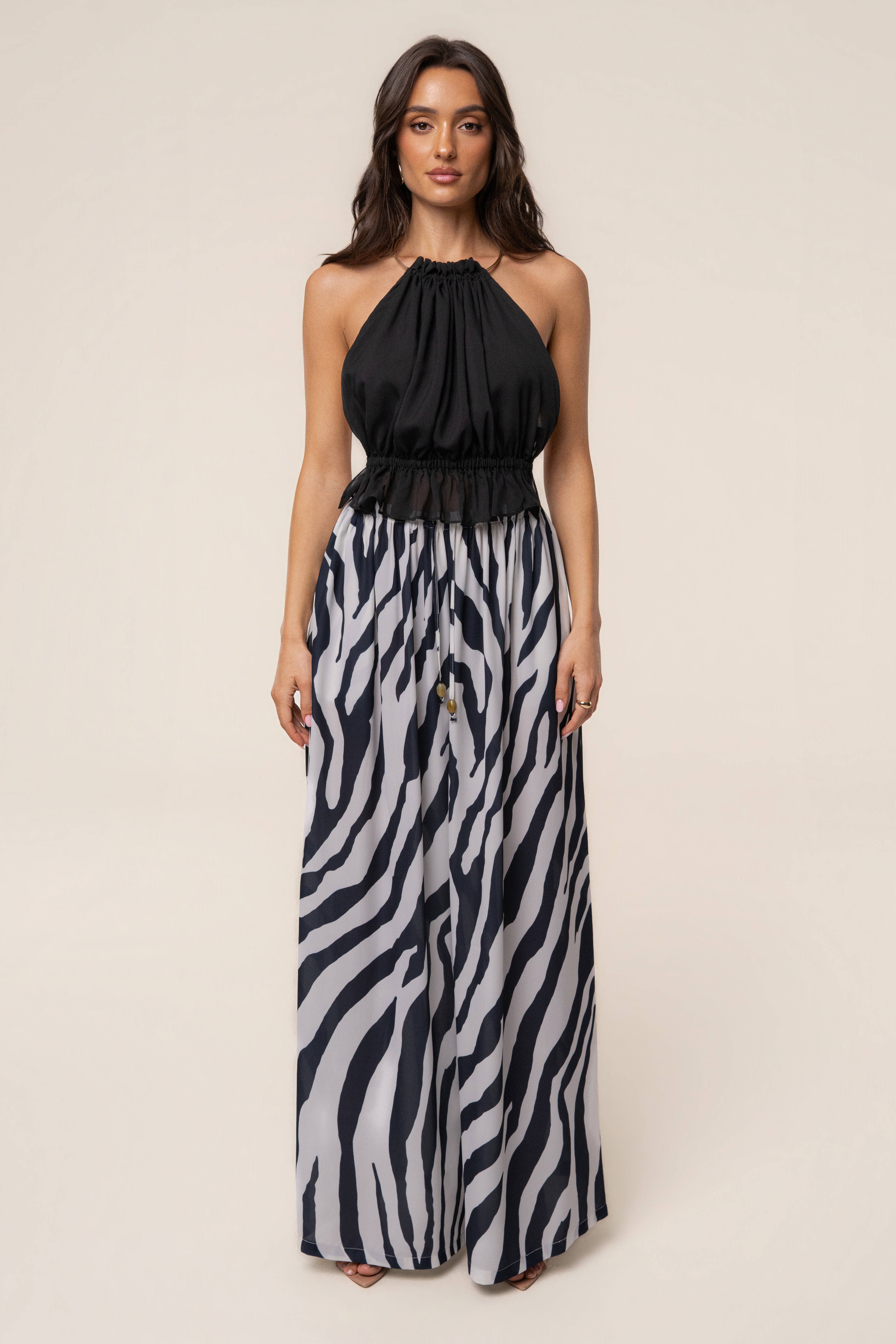 Navy zebra print chiffon resort pants by JLUXLABEL, flowing bottoms with a relaxed fit and stylish pattern.