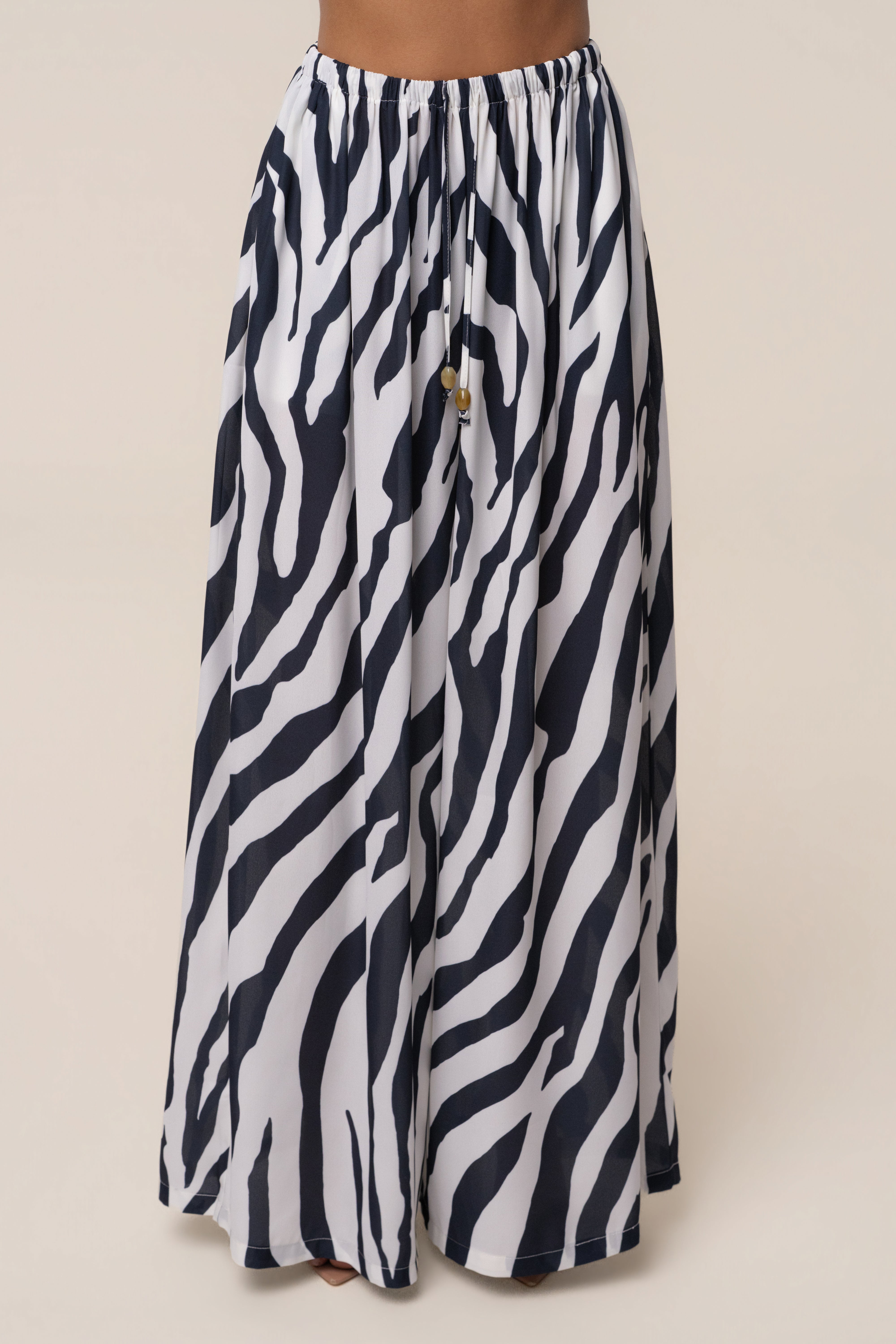 Navy zebra print chiffon pant from JLUXLABEL's resort glow collection, featuring flowy, lightweight fabric and relaxed fit.