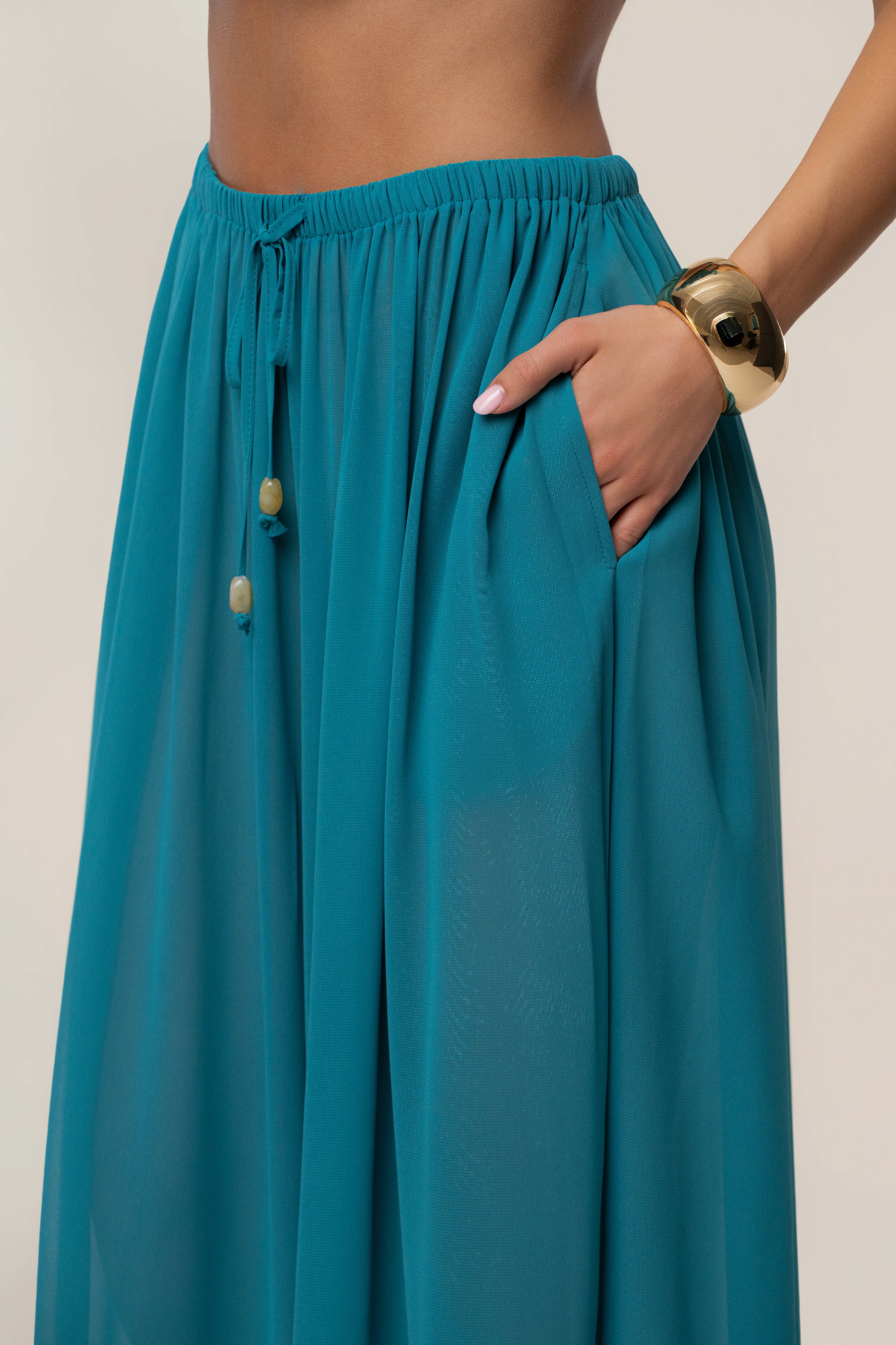 JLUXLABEL Aqua Resort Glow chiffon pants, stylish women's bottoms with flowy fabric and vibrant color, perfect for summer wear.