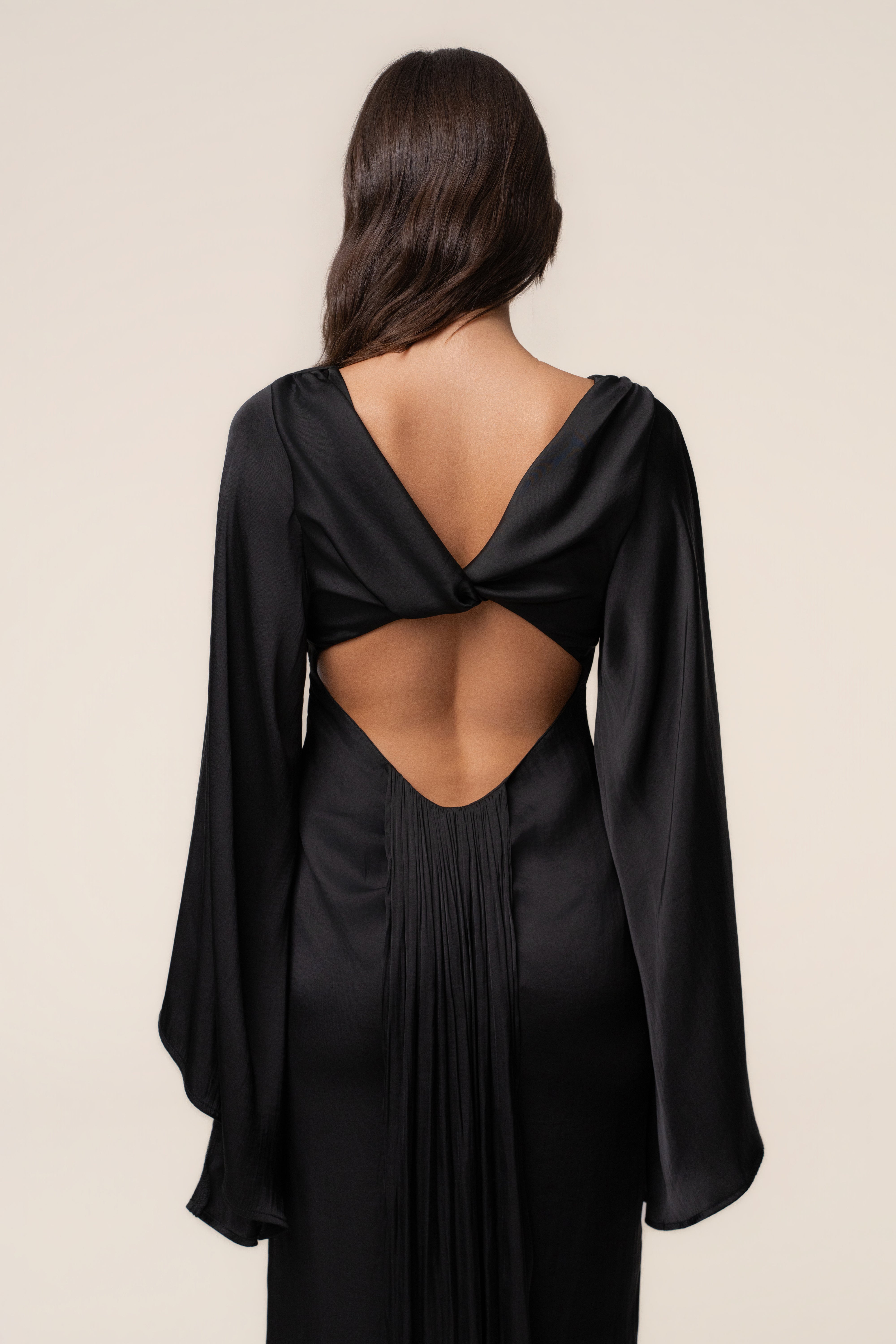 Black soft fabric maxi dress by JLUXLABEL with a flowy silhouette and sleeveless design, perfect for elegant occasions.