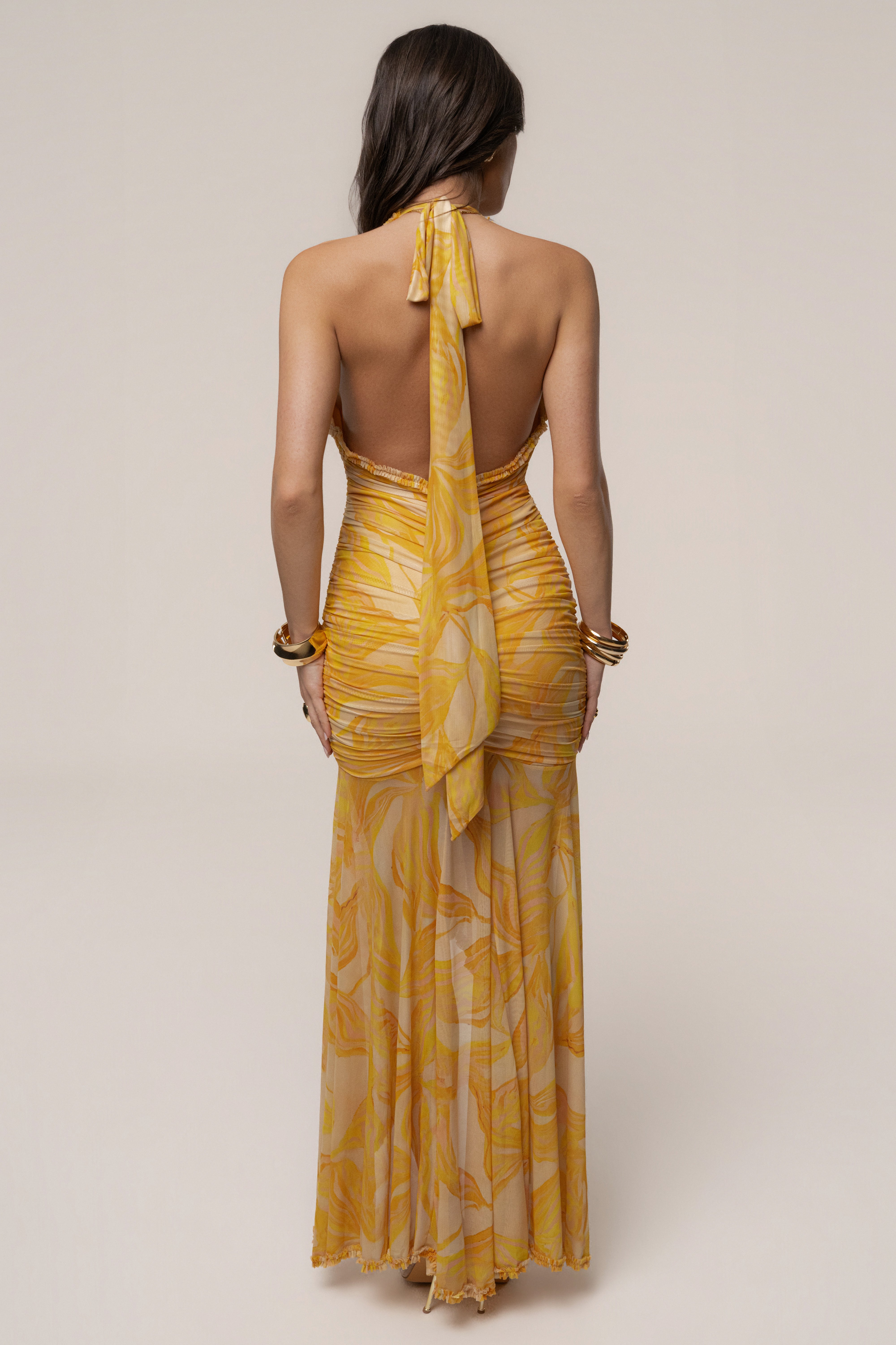 Yellow Paradise Glow maxi dress by JLUXLABEL featuring a flowing silhouette and vibrant yellow fabric.