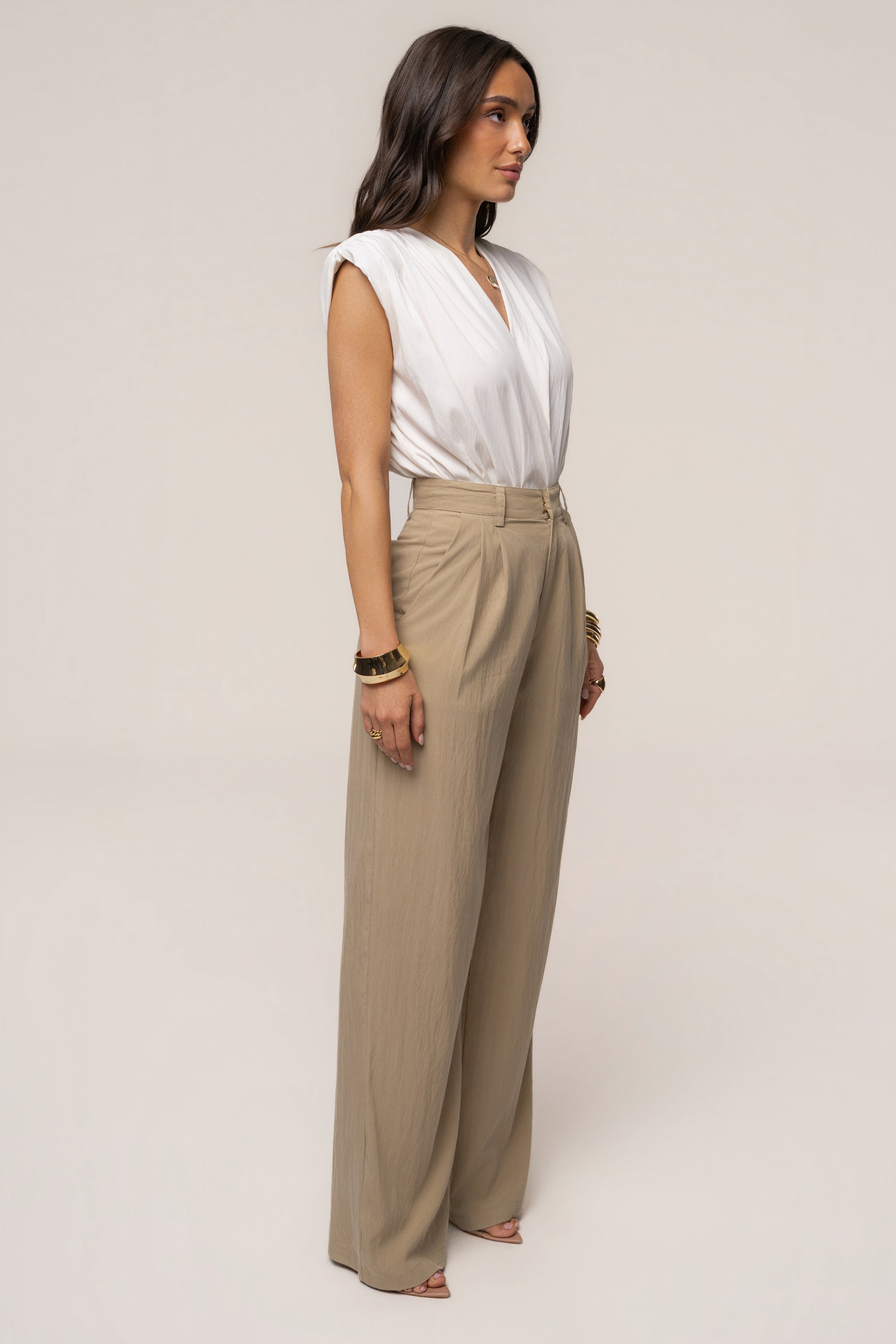Ivory solar drift bodysuit by JLUXLABEL, showcasing a fitted tops style with smooth fabric and stylish design.