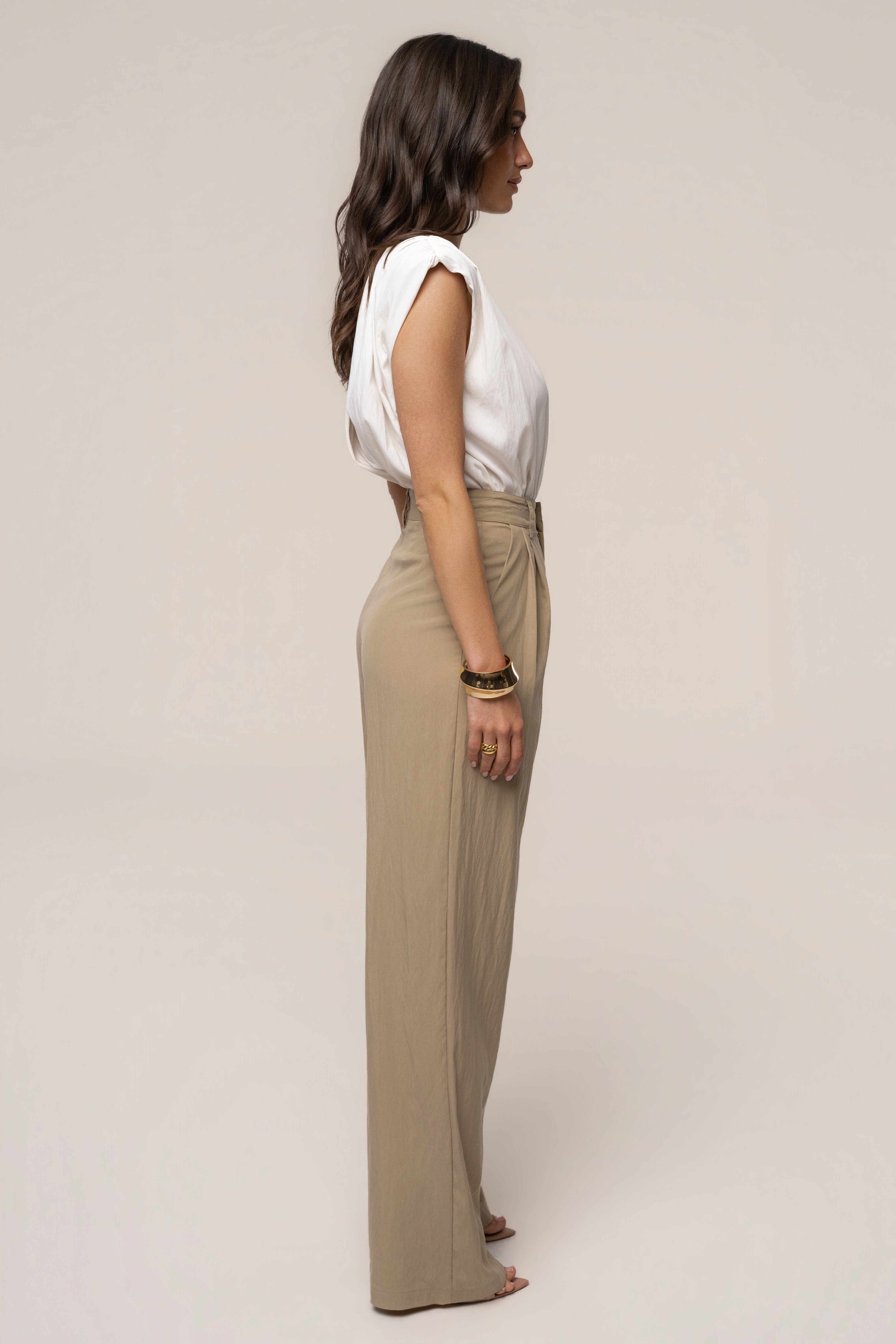 Ivory solar drift bodysuit by JLUXLABEL, featuring a sleek, fitted top with solar-inspired design details.