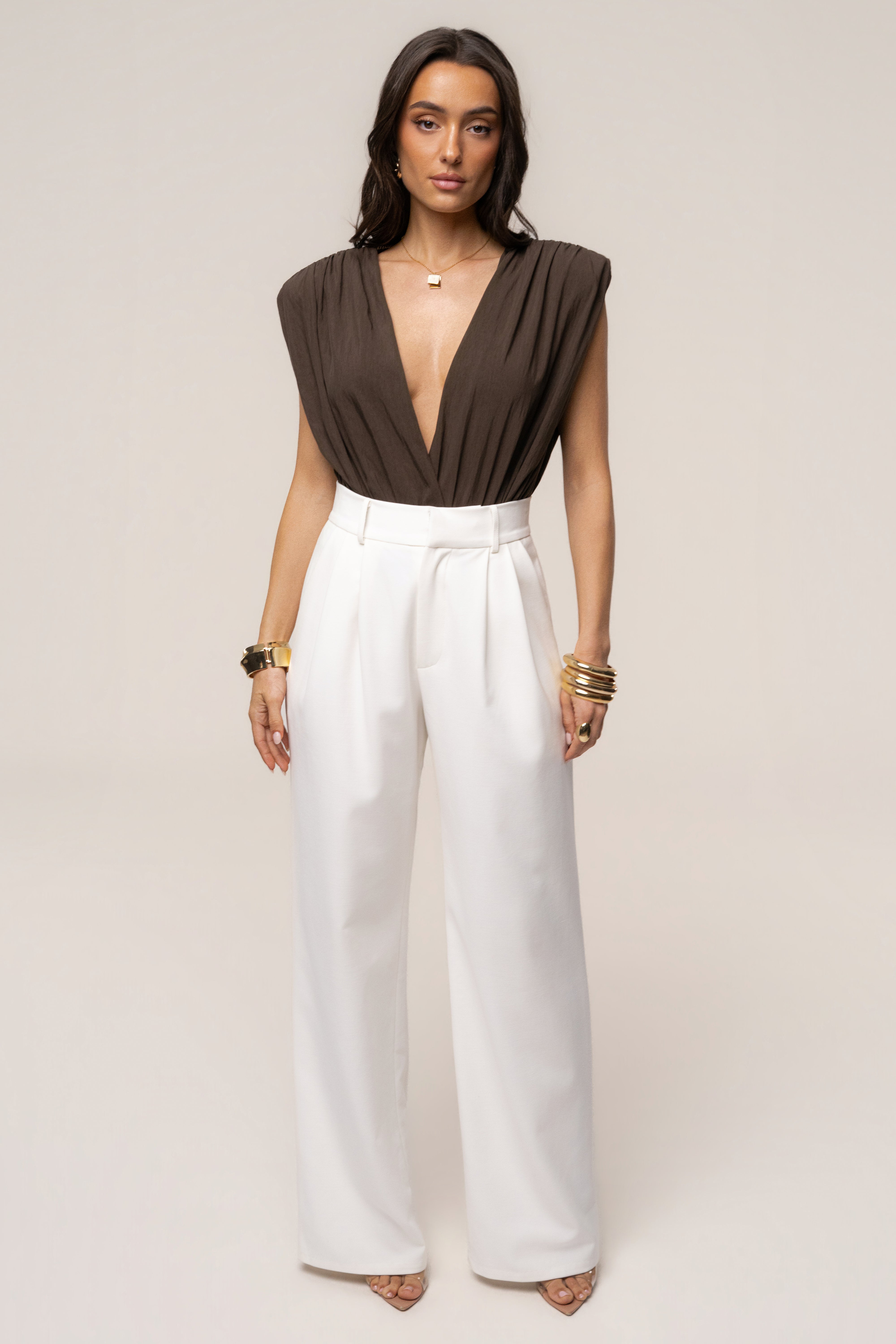 Brown solar drift bodysuit from JLUXLABEL, featuring a stylish, fitted top with long sleeves and a sleek design.