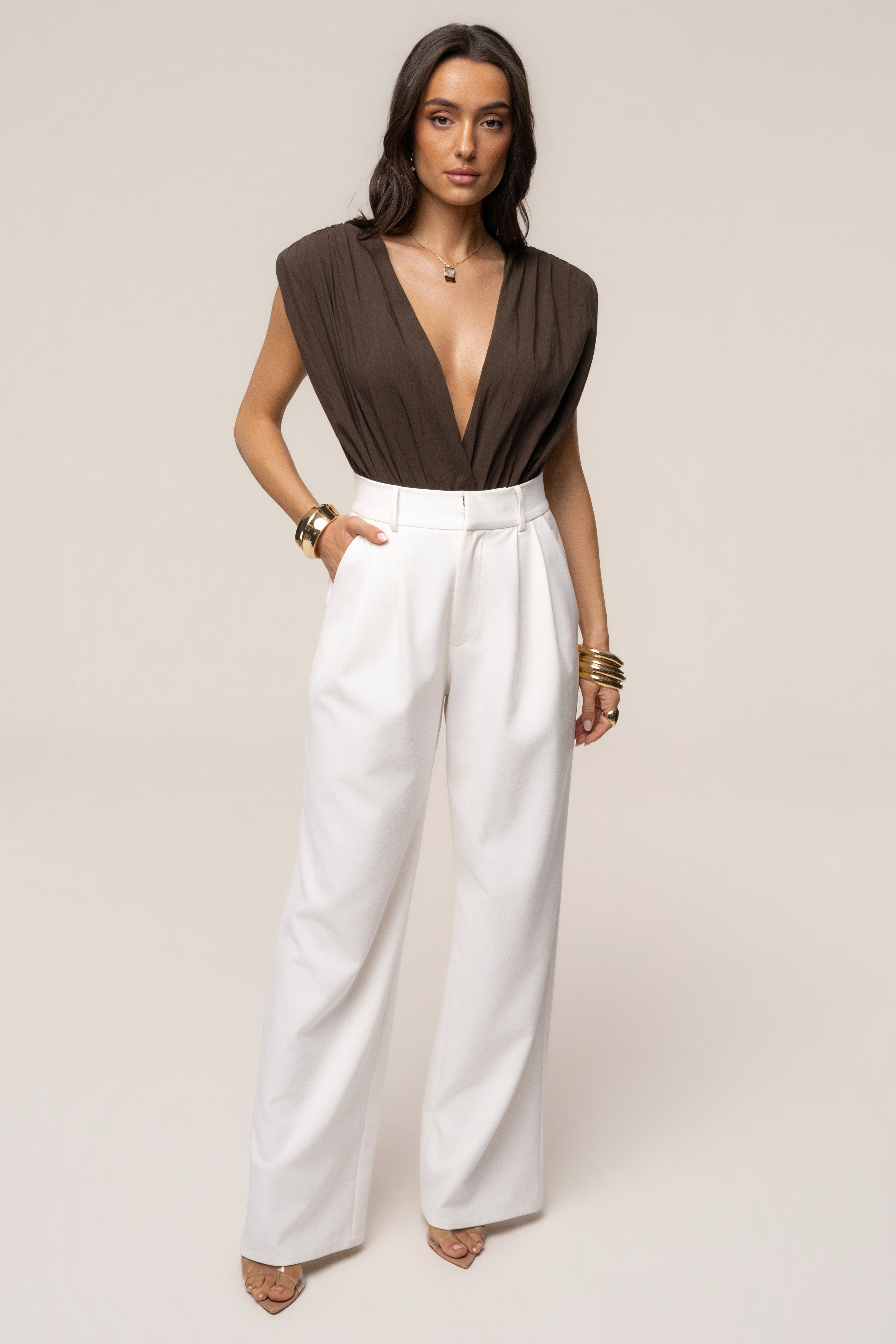 Brown Solar Drift Bodysuit from JLUXLABEL, a stylish long-sleeve top with a fitted design and soft fabric.