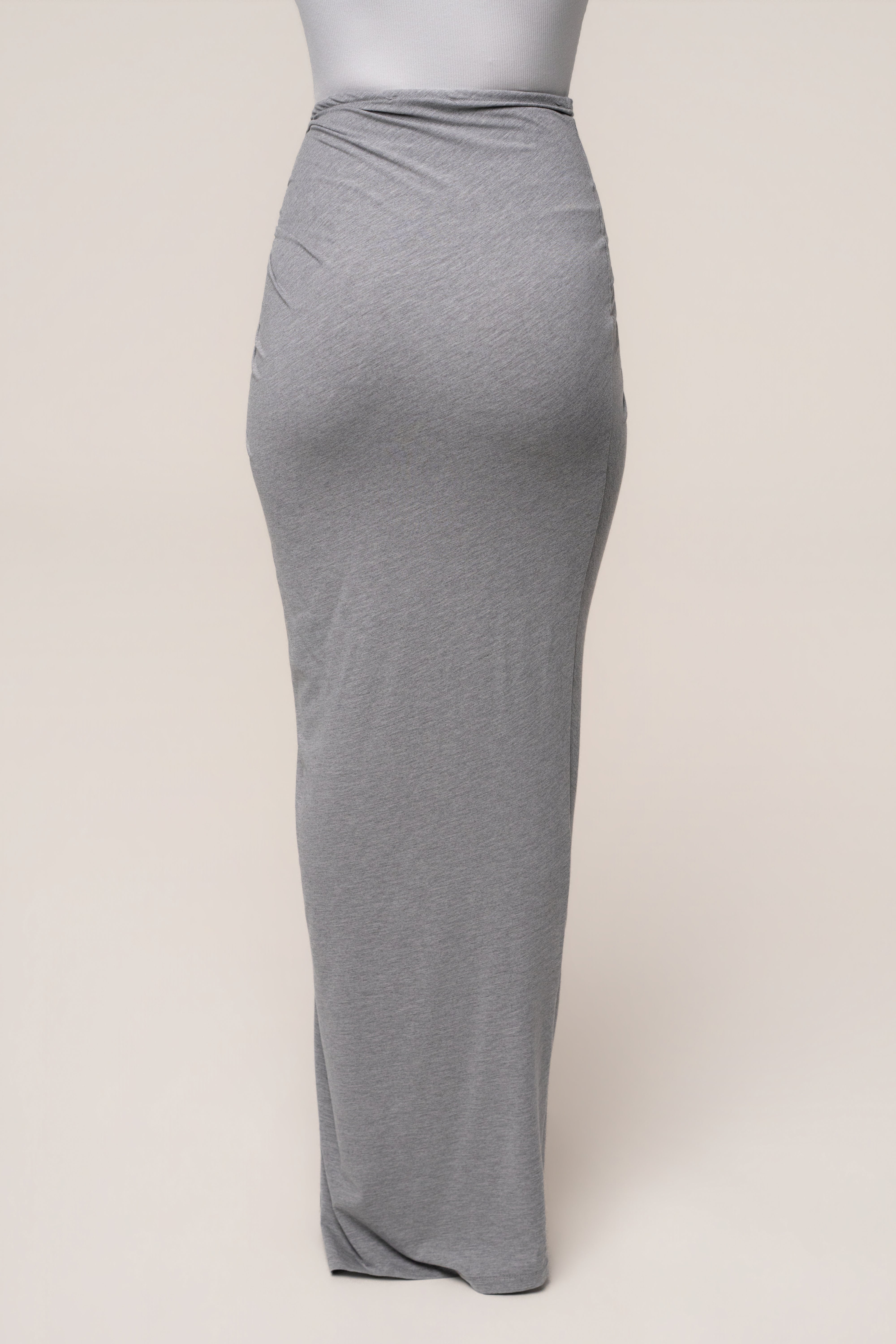 Heather grey Island Drape maxi skirt by JLUXLABEL, featuring a flowy silhouette and draped design, shown on a model.