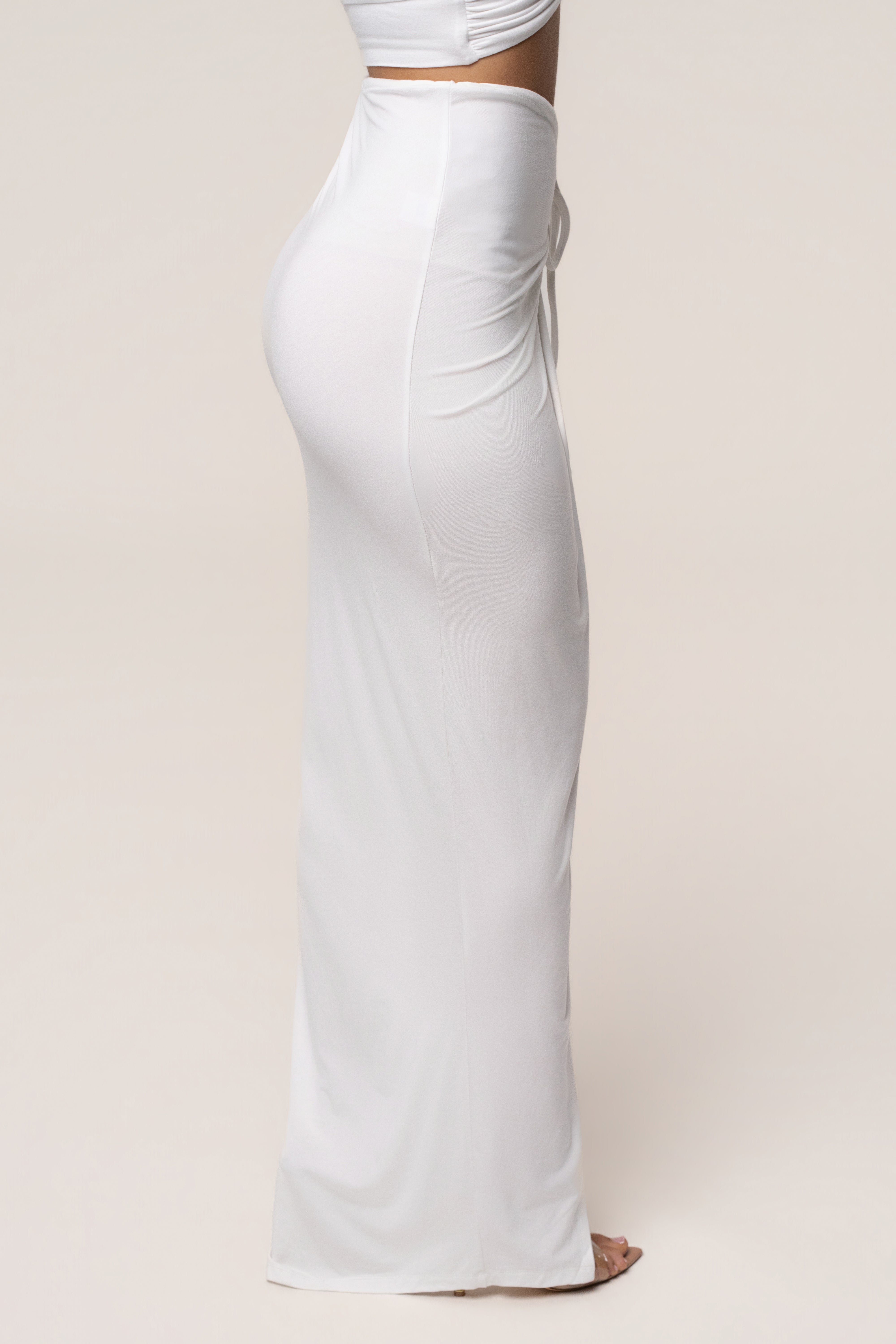 White Island Drape Maxi Skirt by JLUXLABEL, flowing white skirt with draped design, styled as a stylish bottoms piece.