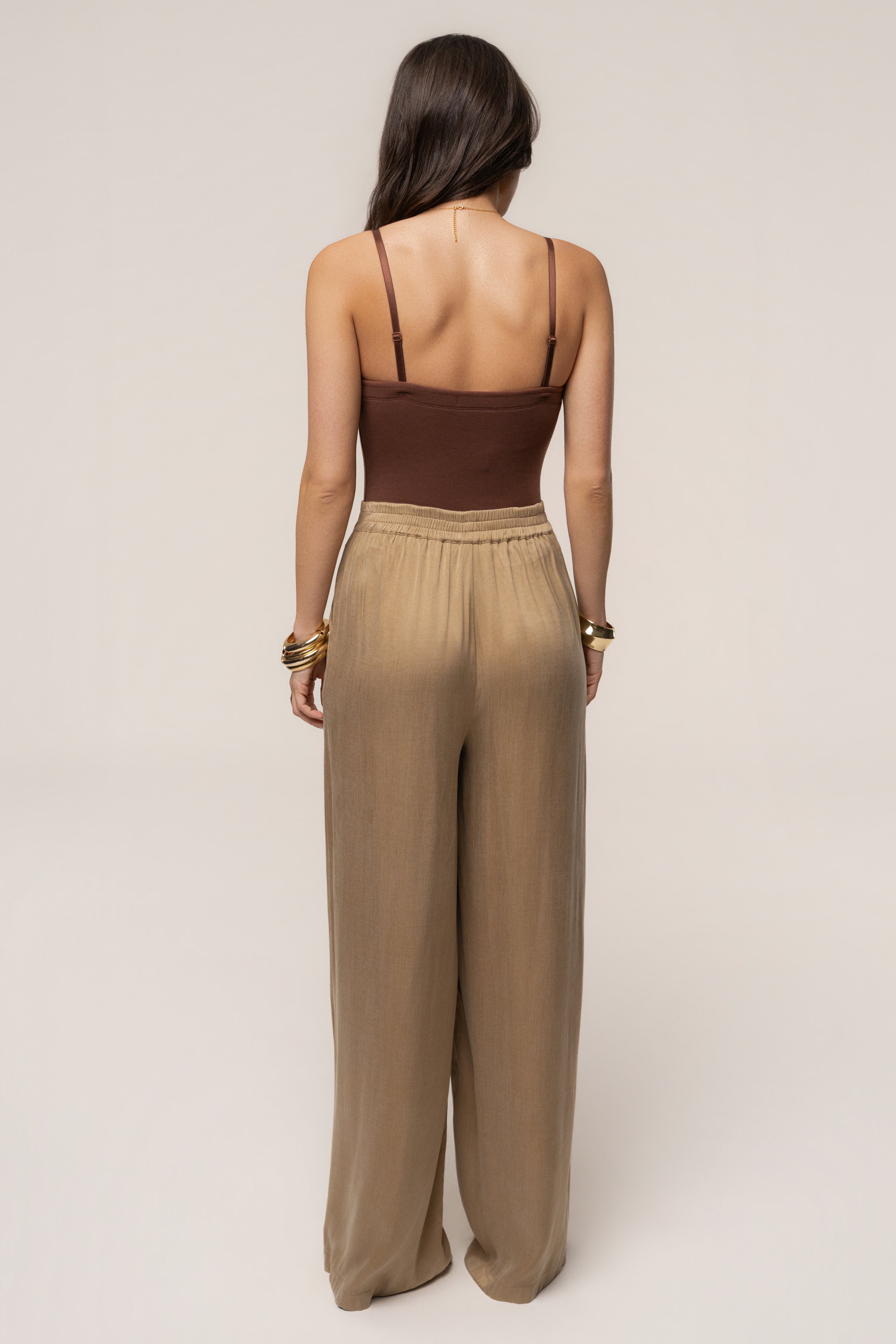 Black chocolate Sascha strapless bodysuit by JLUXLABEL, featuring a sleek, fitted top with a strapless design and smooth fabric.