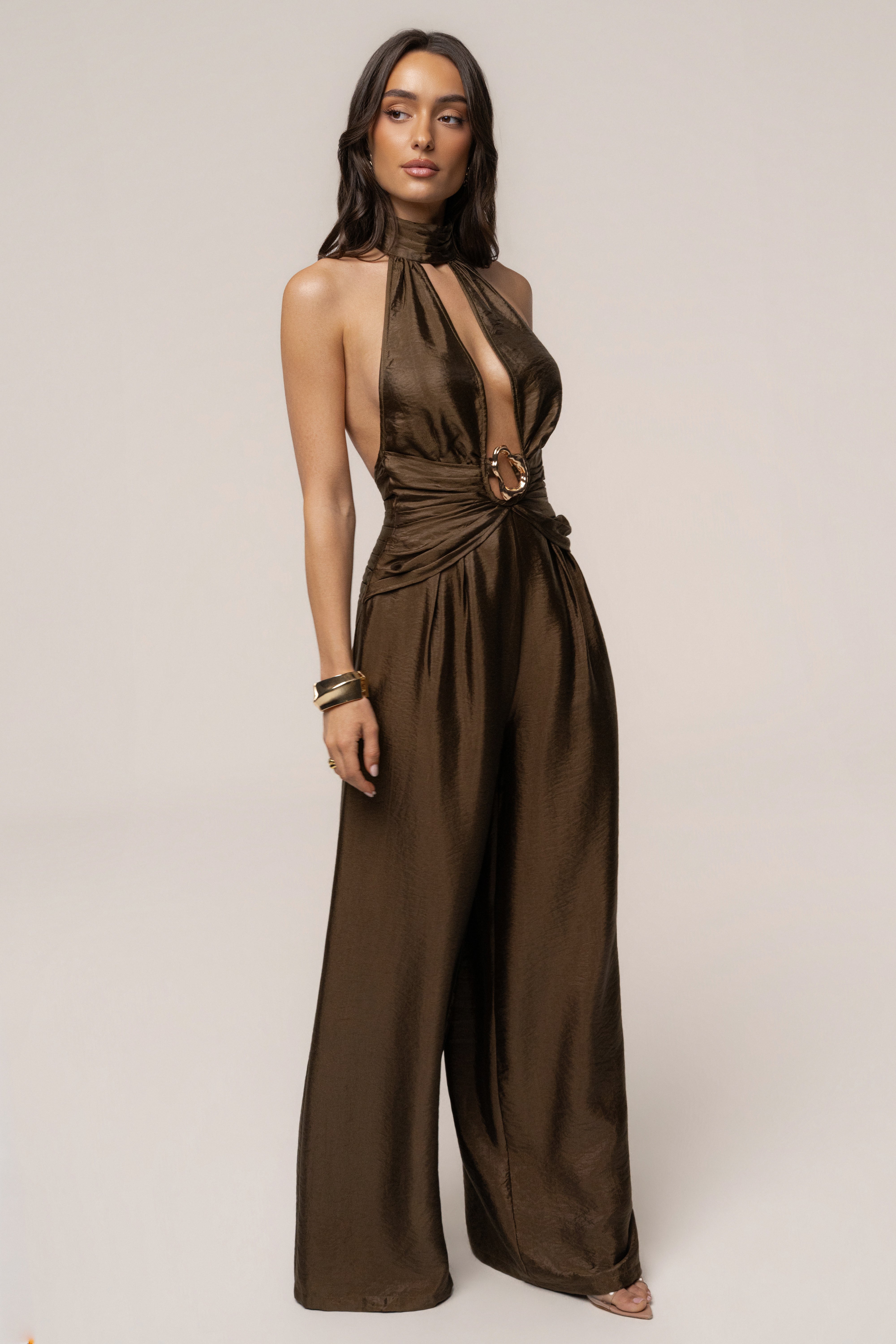Olive green JLUXLABEL jumpsuit with accent detailing, stylish sleeveless design, and fitted waist for a chic look.