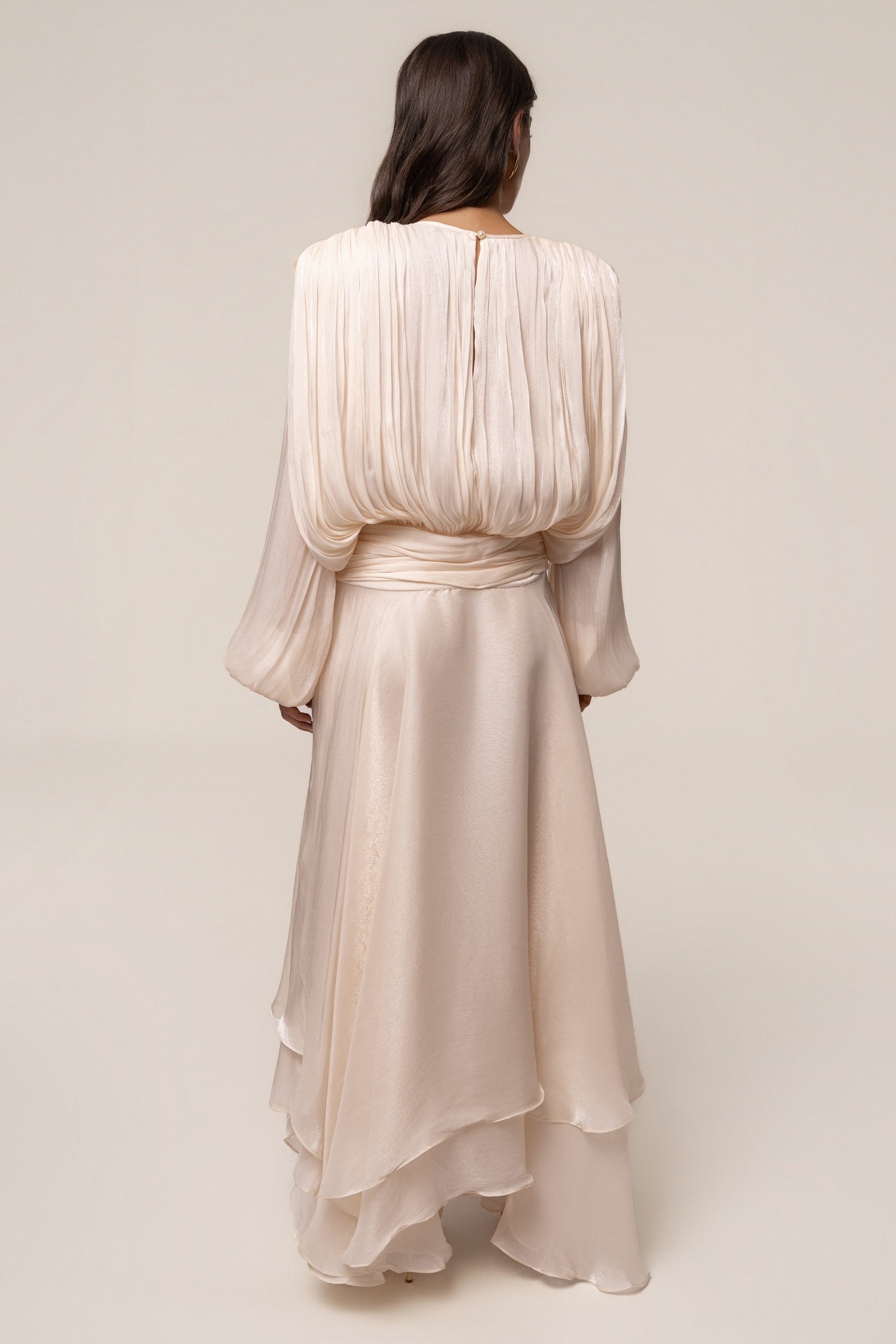 Cream Draped In Elegance Maxi Dress by JLUXLABEL, showcasing a flowing, draped silhouette perfect for formal occasions.