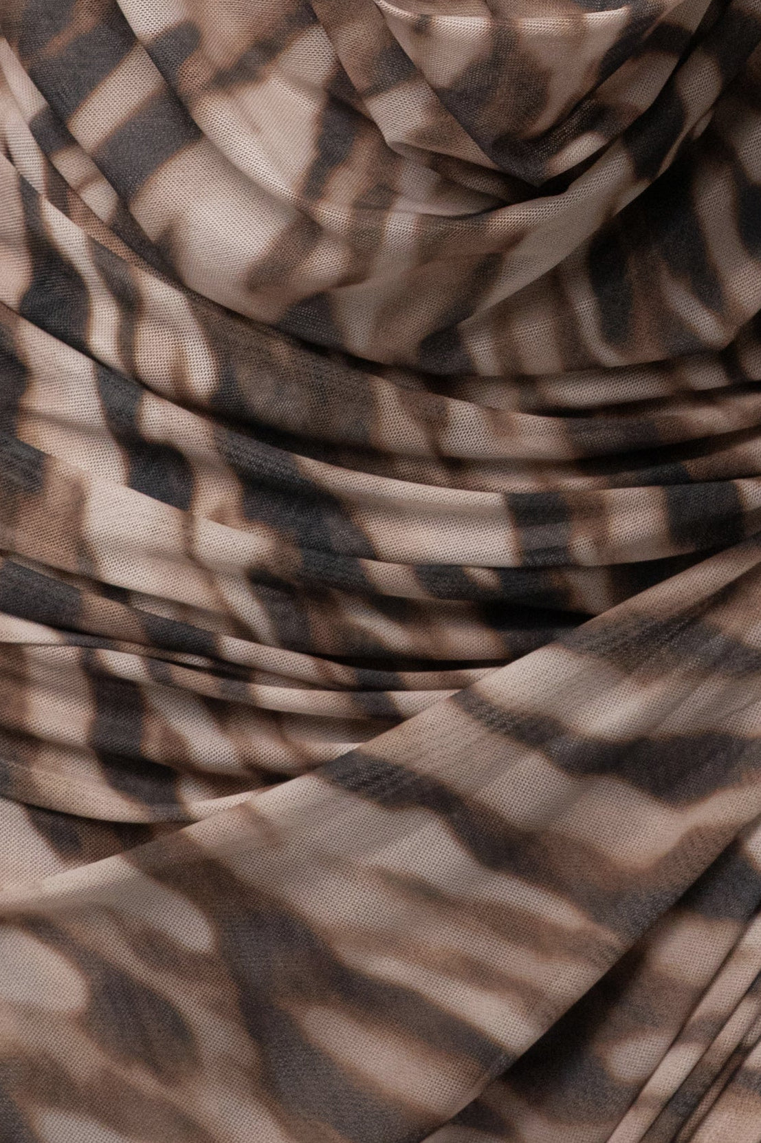 Brown Zebra Ariana plunge halter dress from JLUXLABEL featuring a fitted silhouette and bold zebra print fabric.