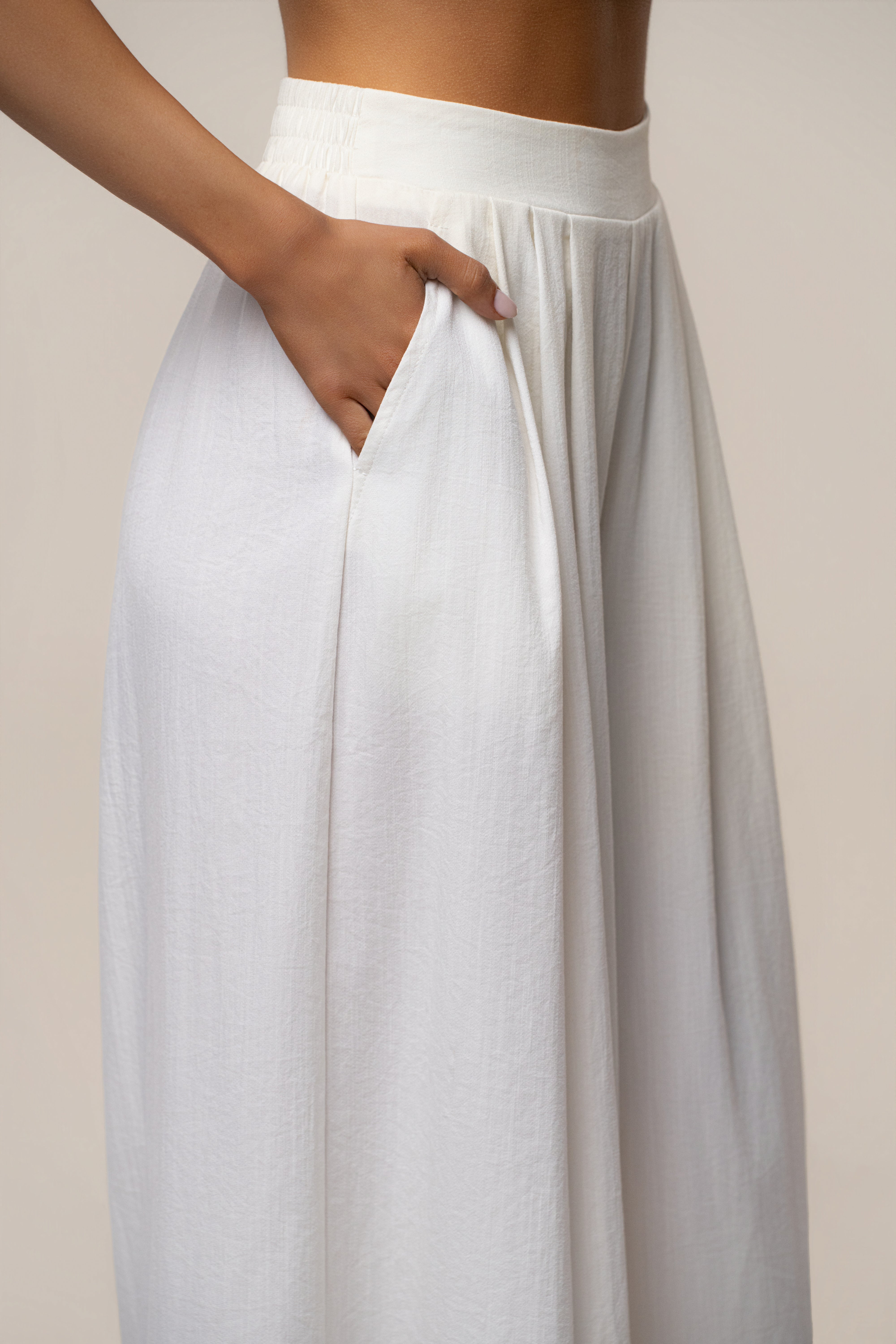Close-up of ivory Sunset Breeze Pant Set waist showing elastic band and a pocket detail.