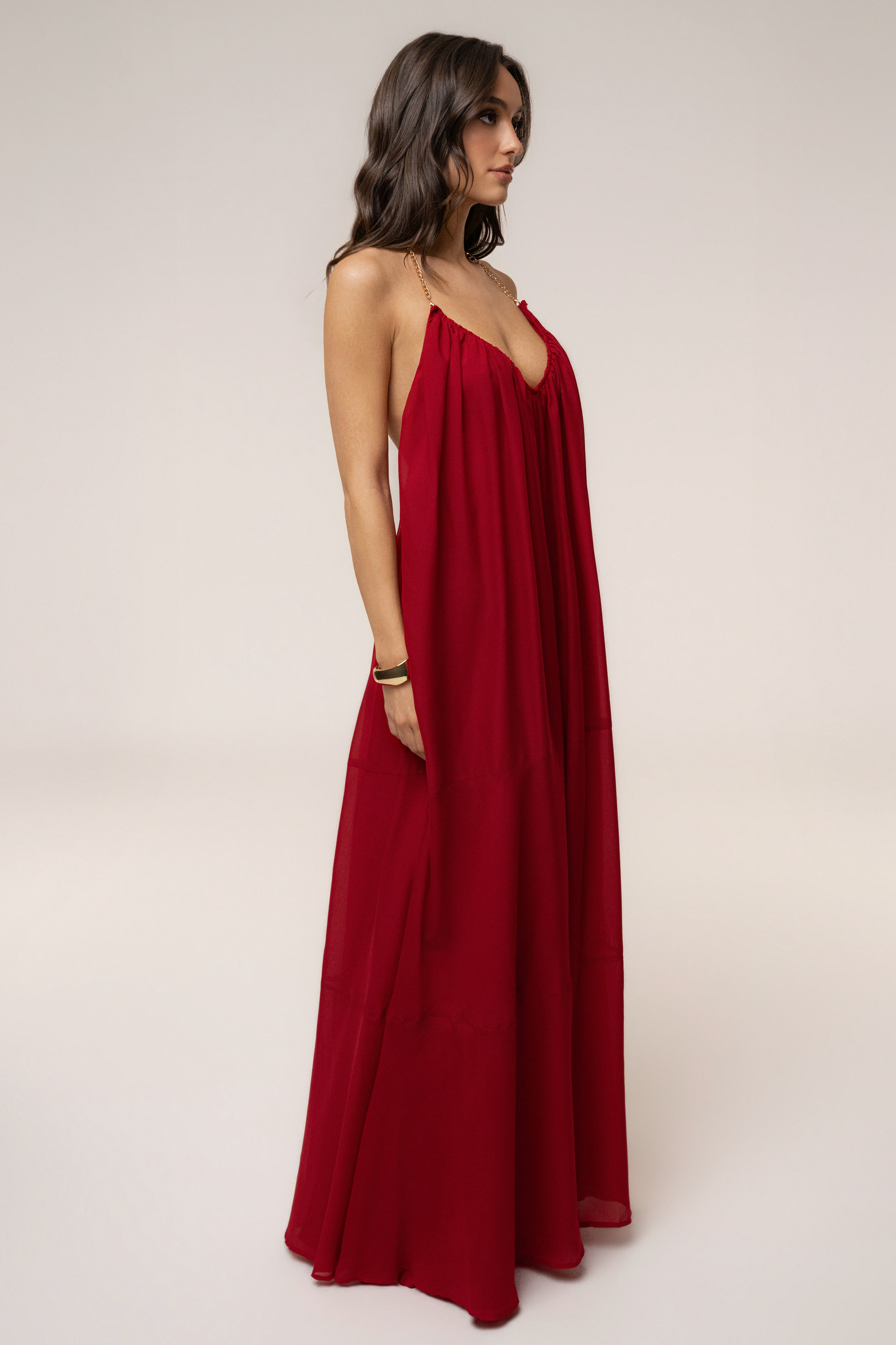Red Hana backless maxi dress by JLUXLABEL, flowing fabric with a deep V back, perfect for elegant summer occasions.