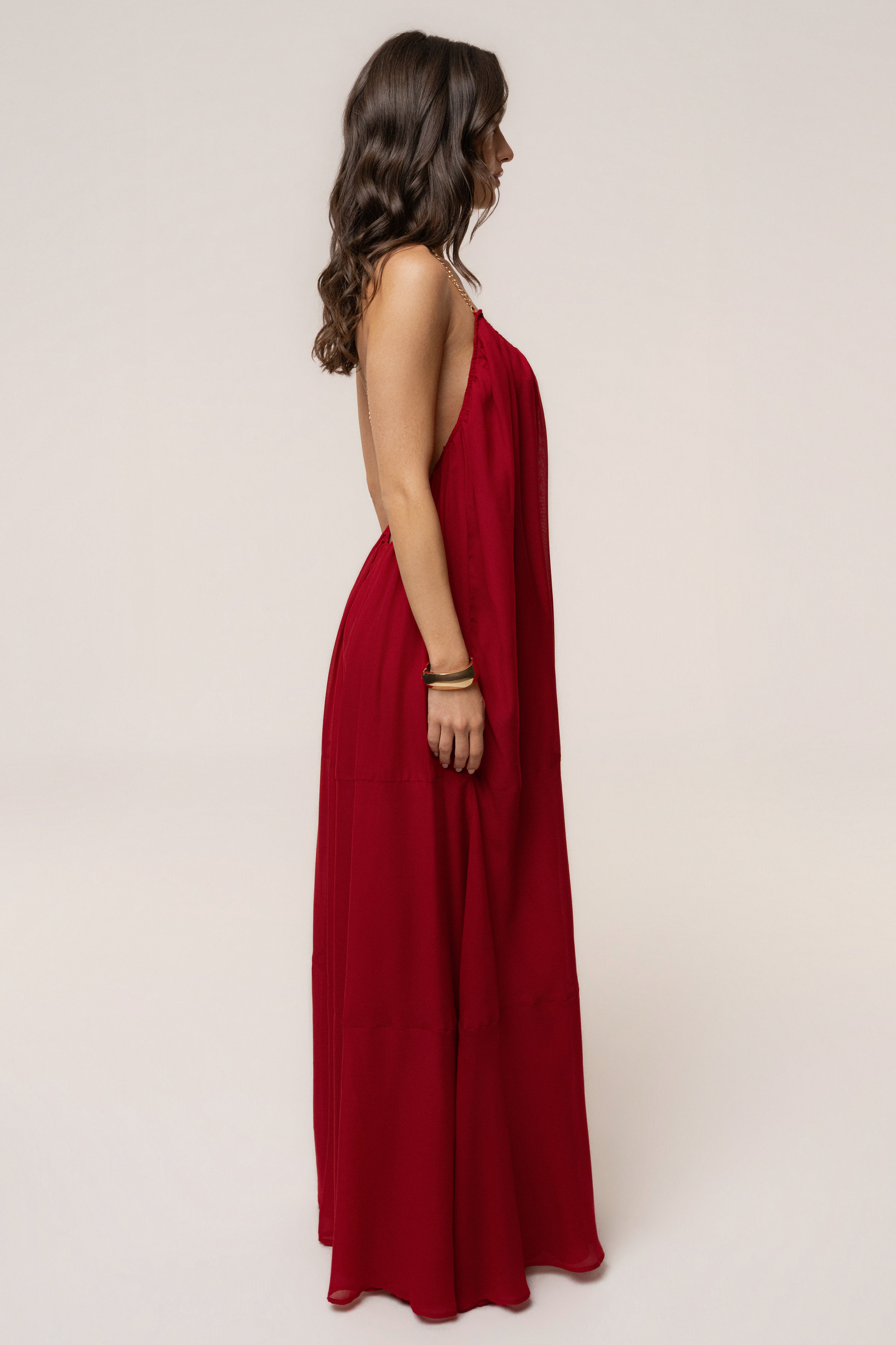 Red Hana backless maxi dress by JLUXLABEL, flowing dress with a deep back and elegant design, shown on a model.