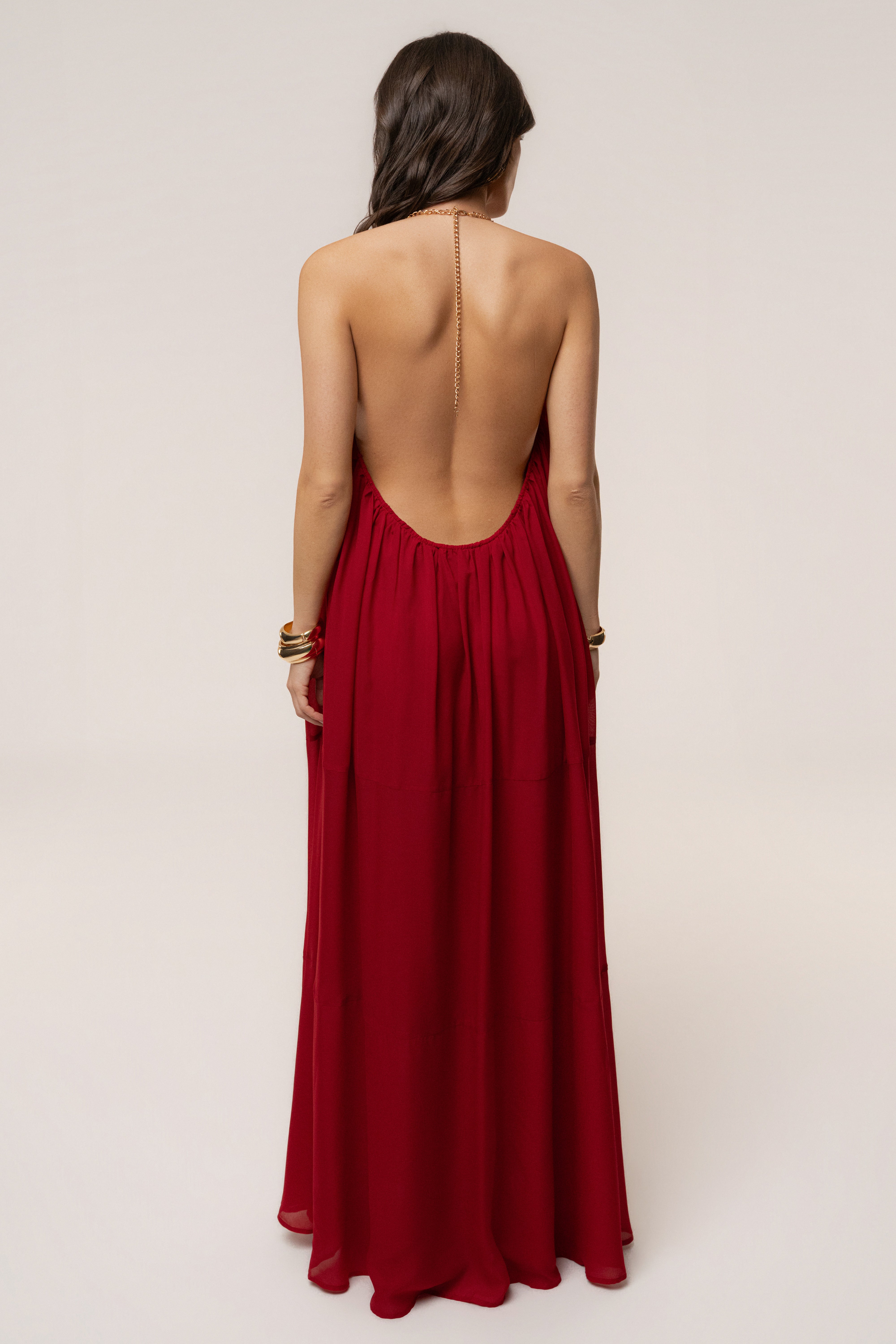 Red Hana backless maxi dress by JLUXLABEL, flowing design with a deep back and elegant style, perfect for summer occasions.
