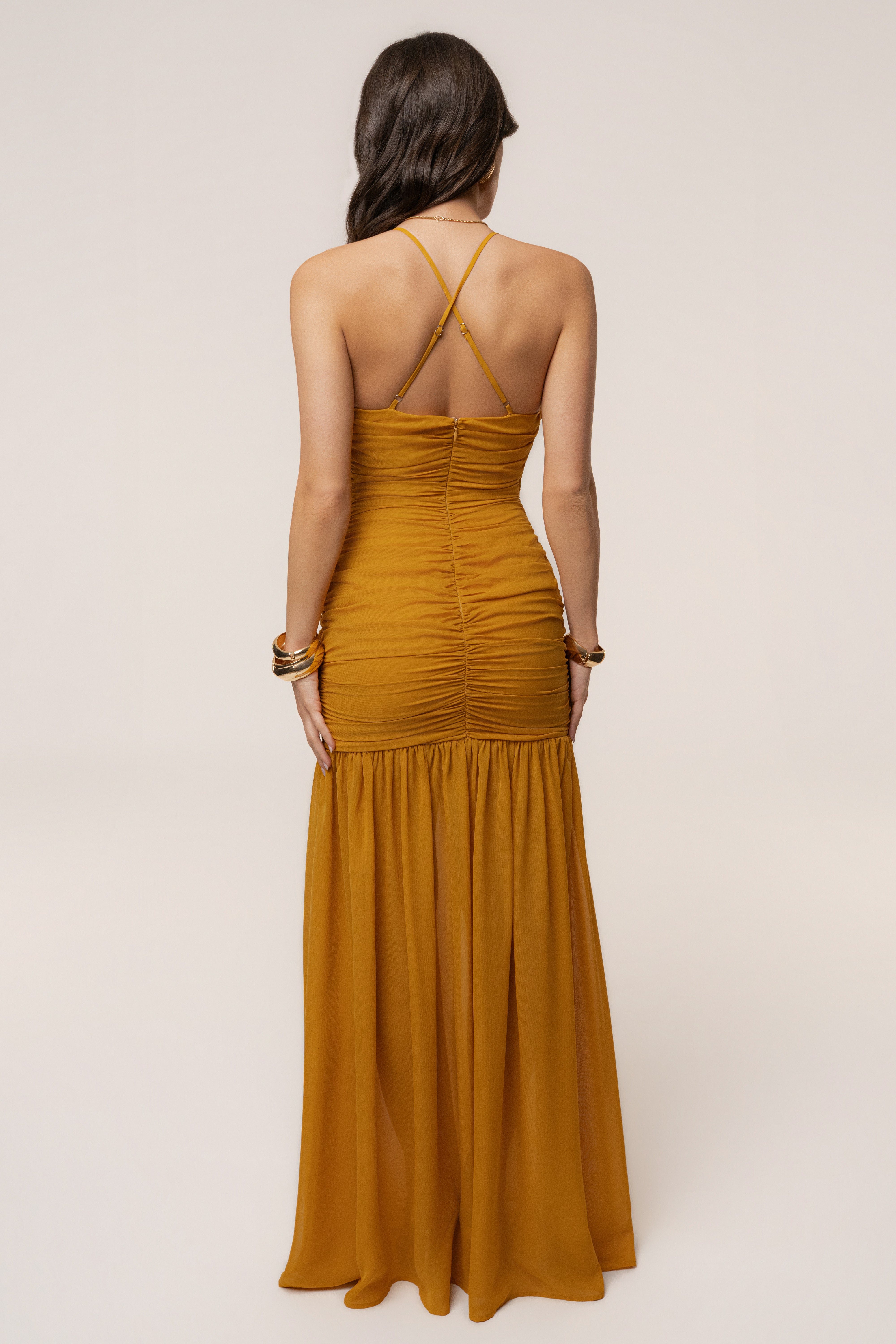 Mustard Vienna chiffon maxi dress by JLUXLABEL, flowing sleeveless dress with a fitted waist and elegant length, styled for summer wear.