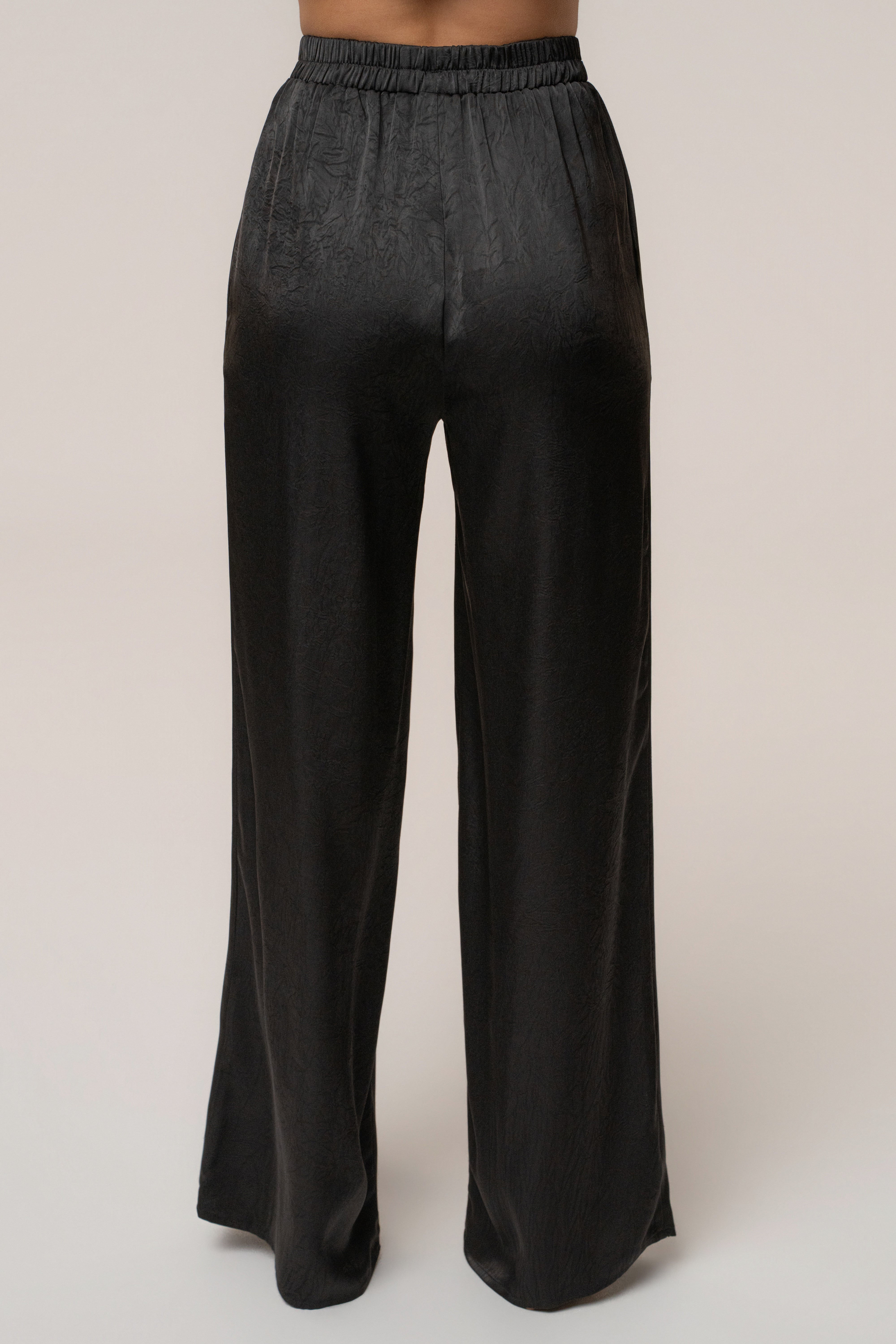 Black satin pant set with draped top and matching pants from JLUXLABEL, featuring a sleek, stylish design.