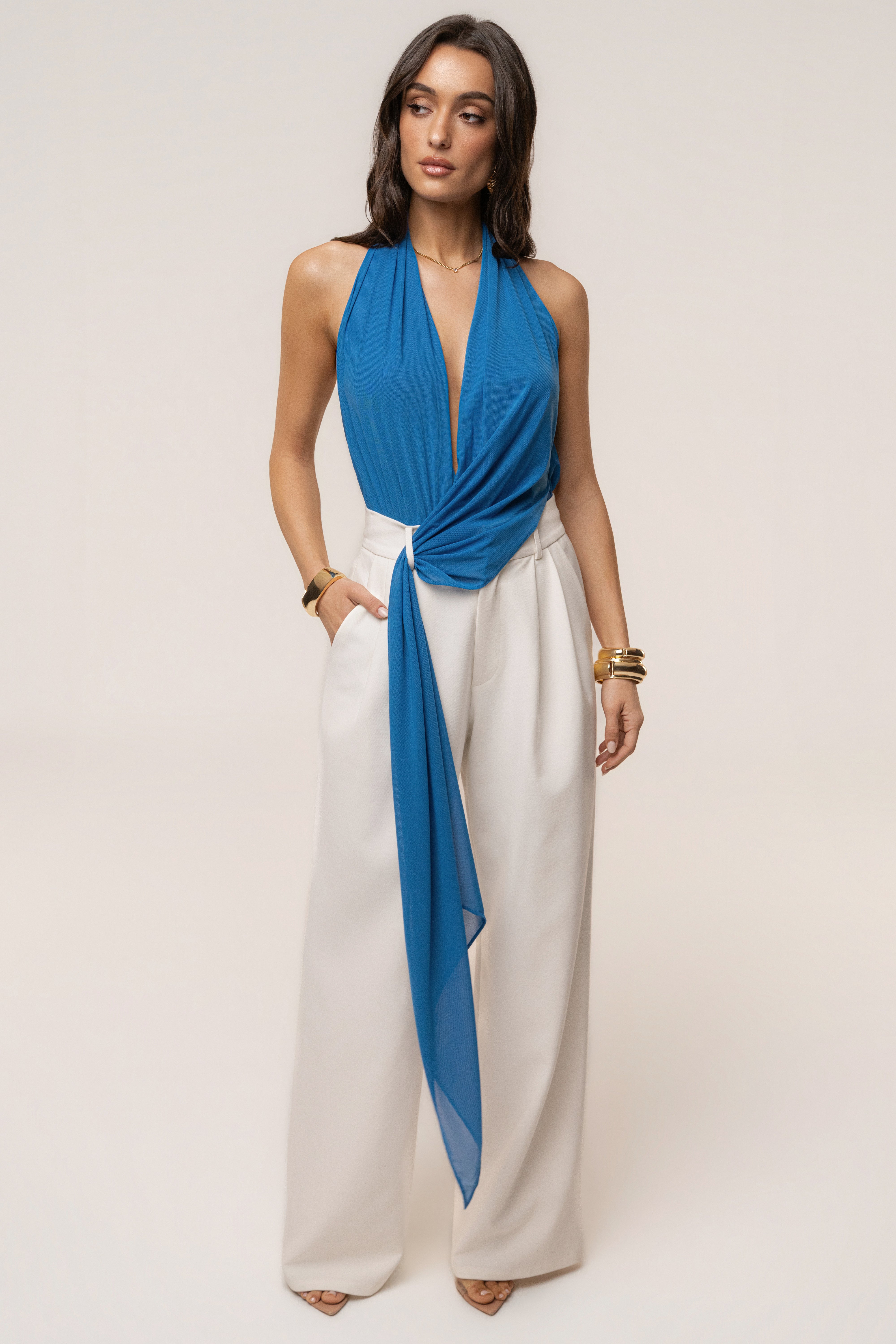 Blue JLUXLABEL Bare Form plunge bodysuit, featuring a deep V neckline and fitted design, shown on a model.