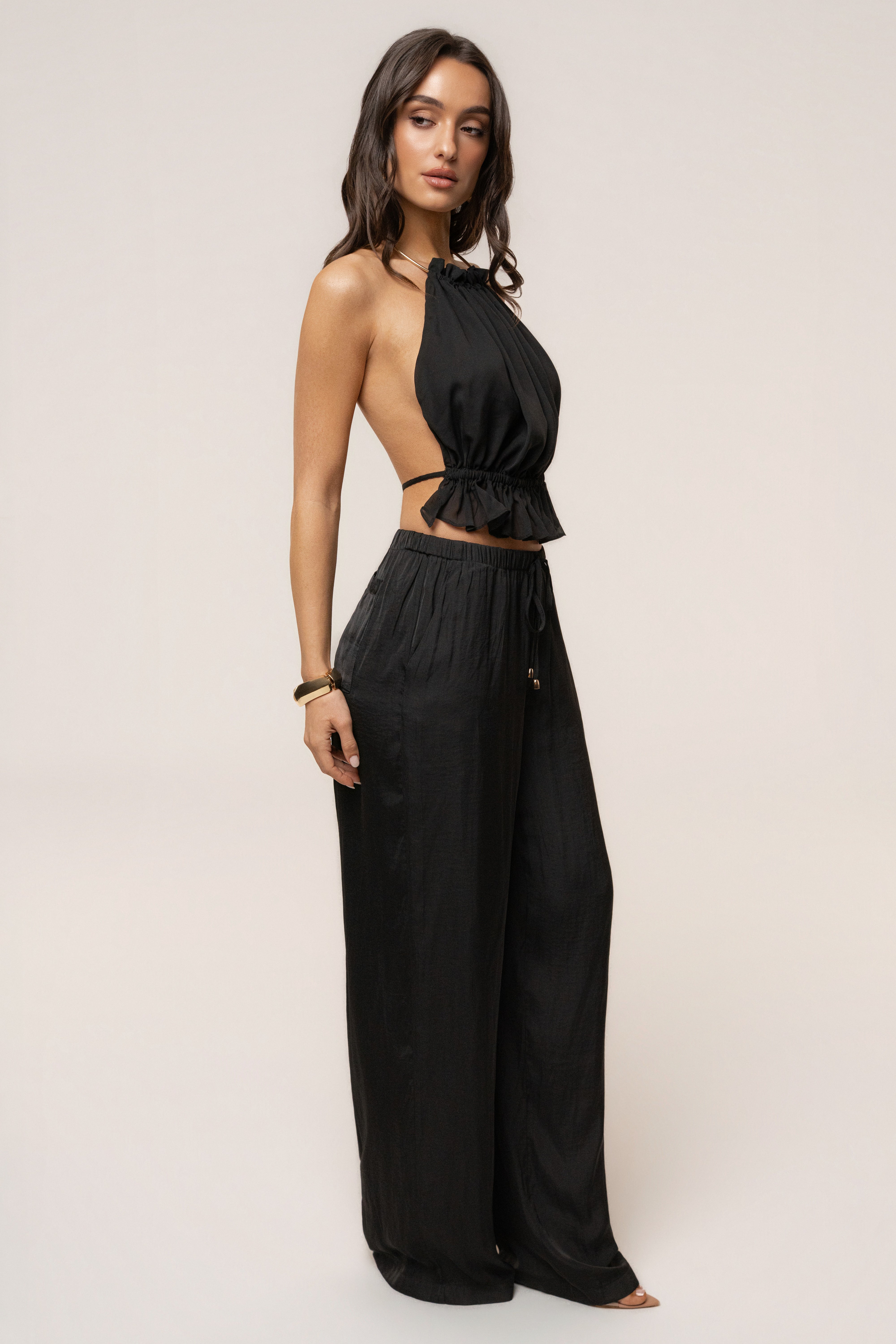 Black Moonlit Coast halter top by JLUXLABEL, featuring a stylish design with a halter neckline and trendy details.