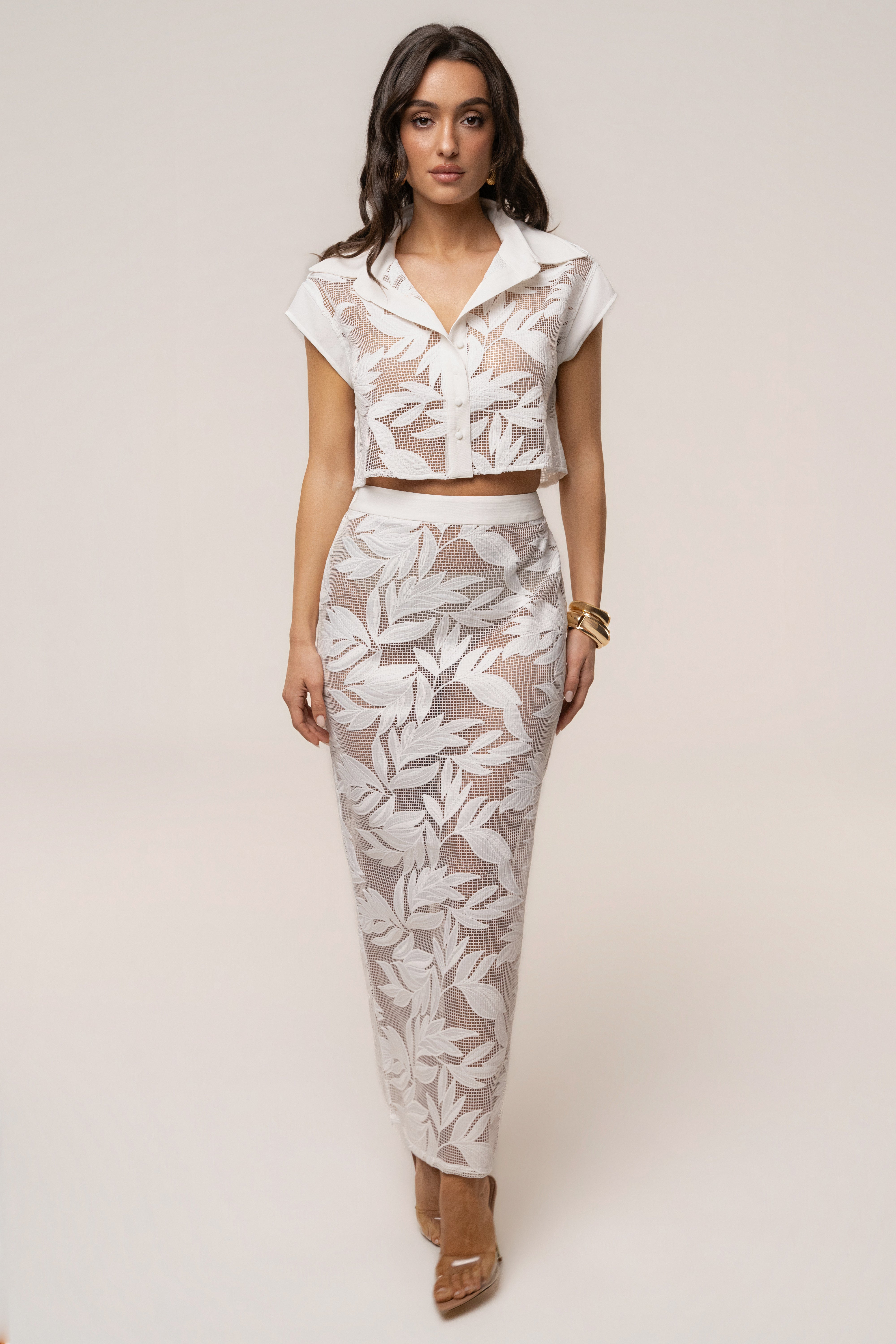 White Bali Nights embroidered skirt from JLUXLABEL, showcasing intricate embroidery and flowing fabric in a stylish bottom.