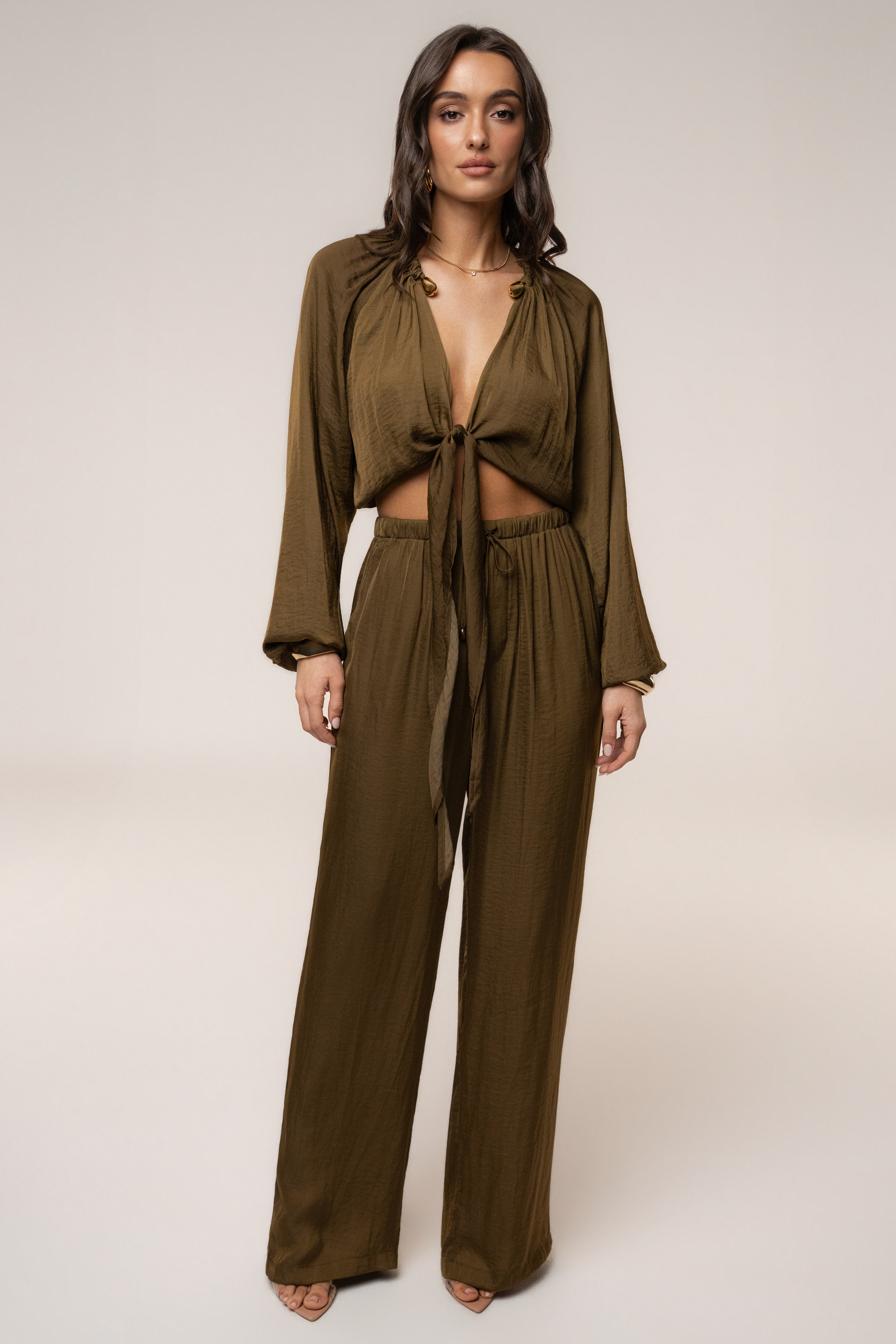 Olive Seaside Glow pants by JLUXLABEL, stylish bottoms with a relaxed fit, featuring a soft fabric and casual design.