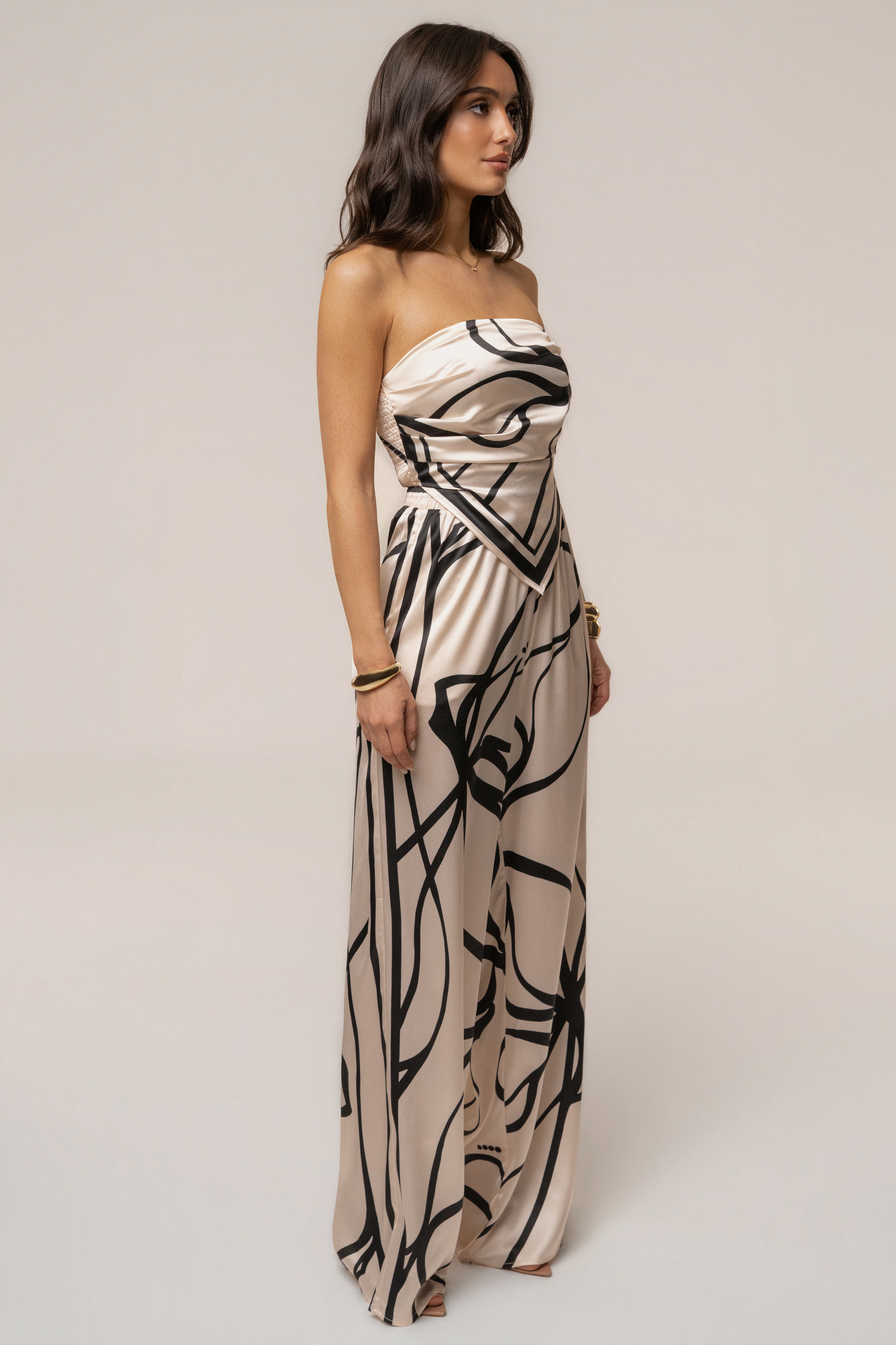 Cream and black art form pant set by JLUXLABEL, featuring stylish matching top and wide-leg pants on a neutral background.